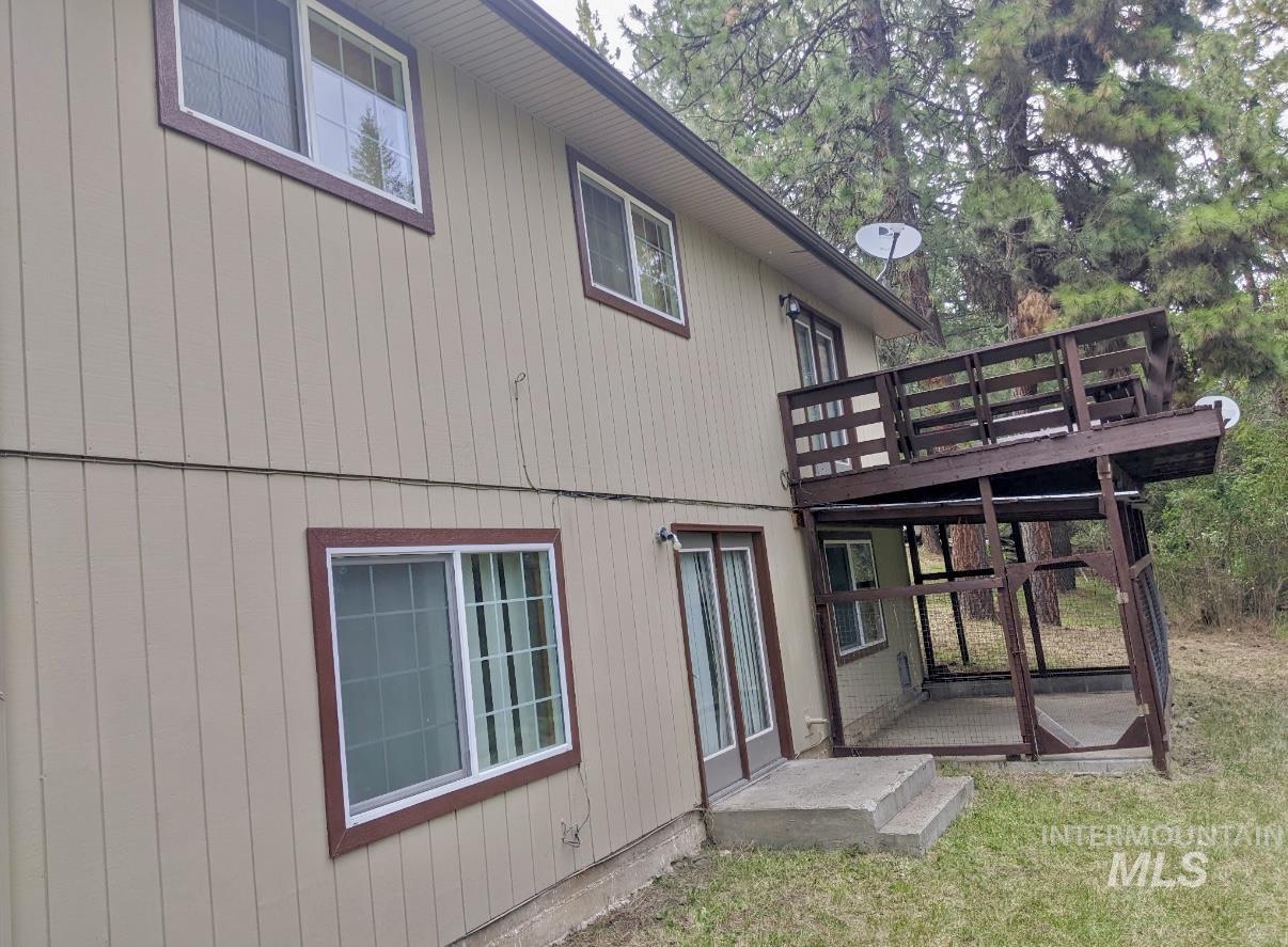 Back of property with a deck