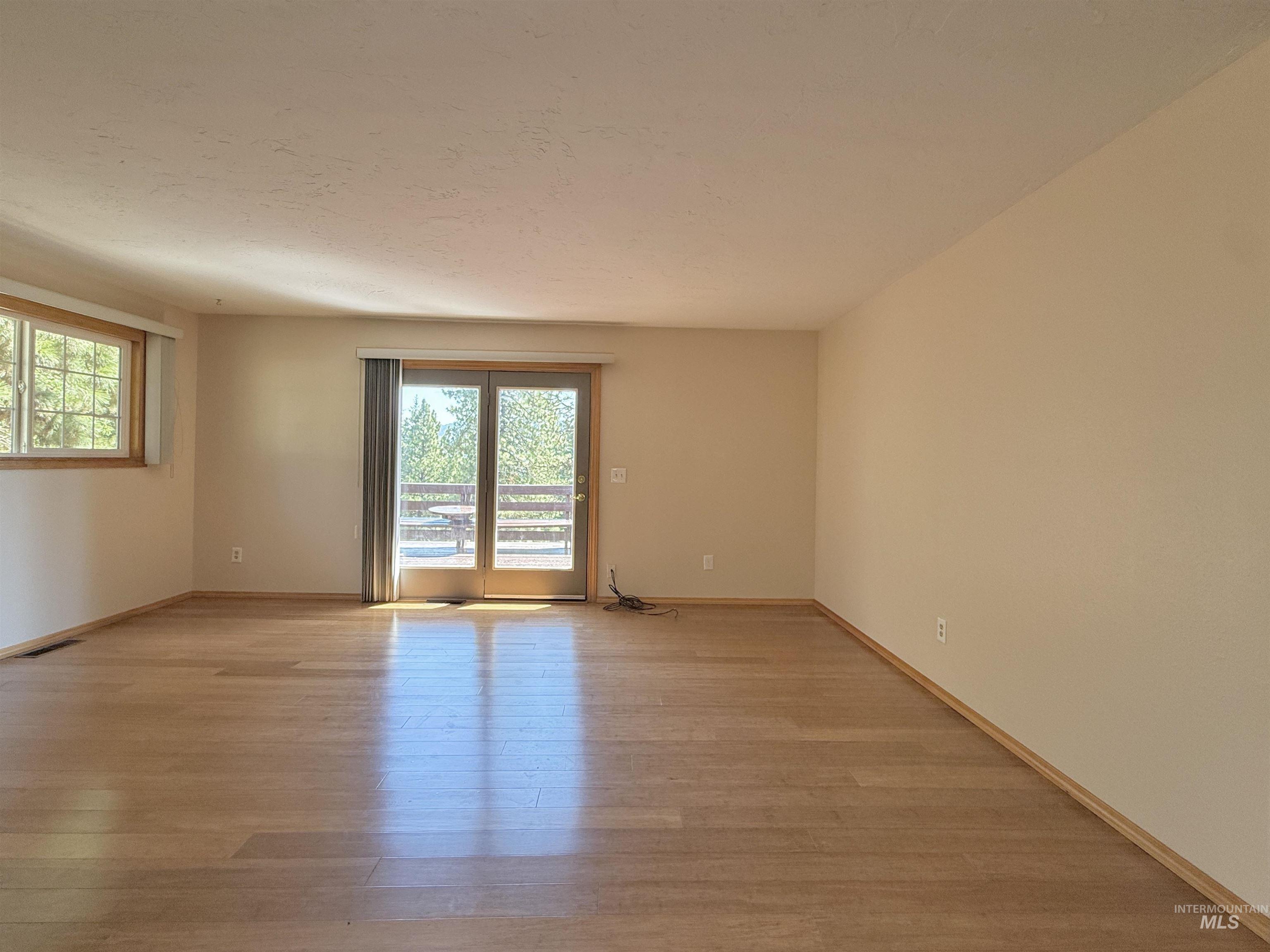 Empty room with light wood-type flooring