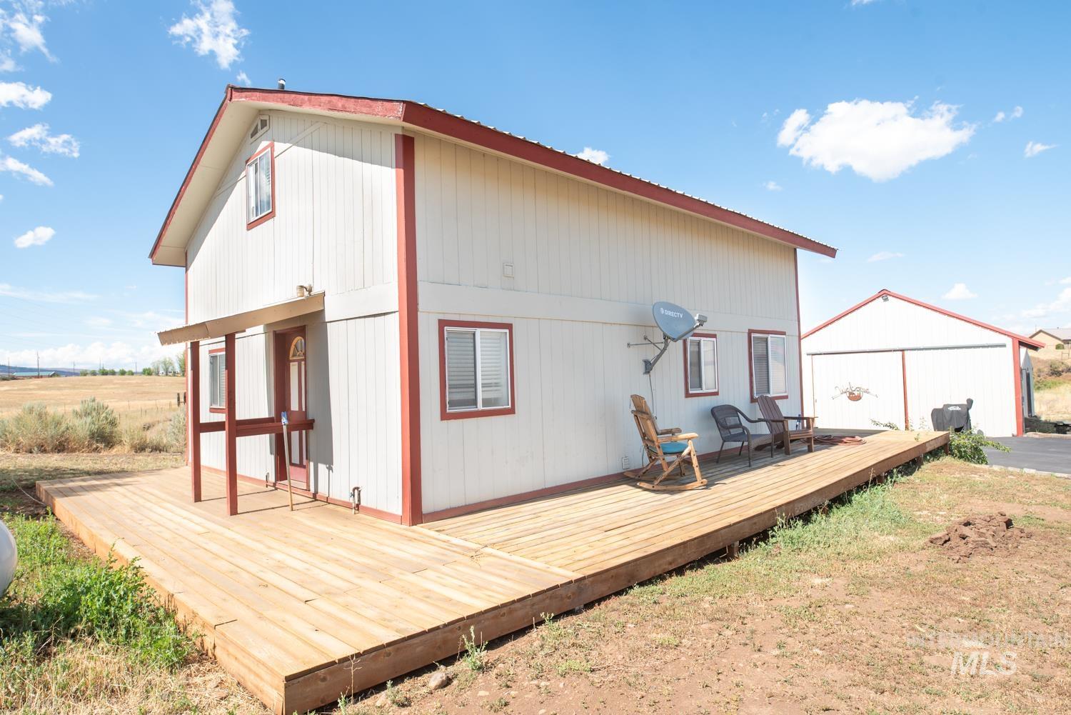 Back of property with a deck