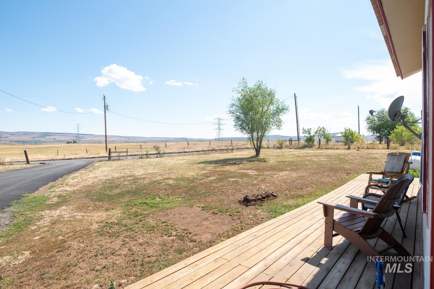 Wooden deck featuring a view of rural / pastoral area