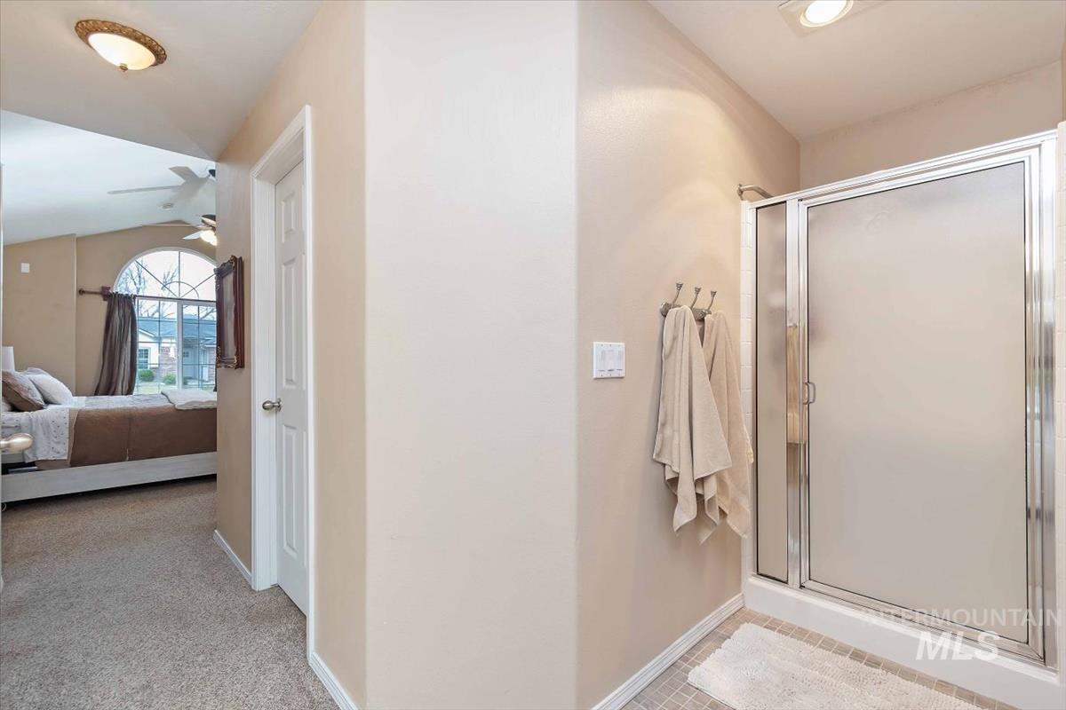 Frosted glass shower enclosure with chrome hardware