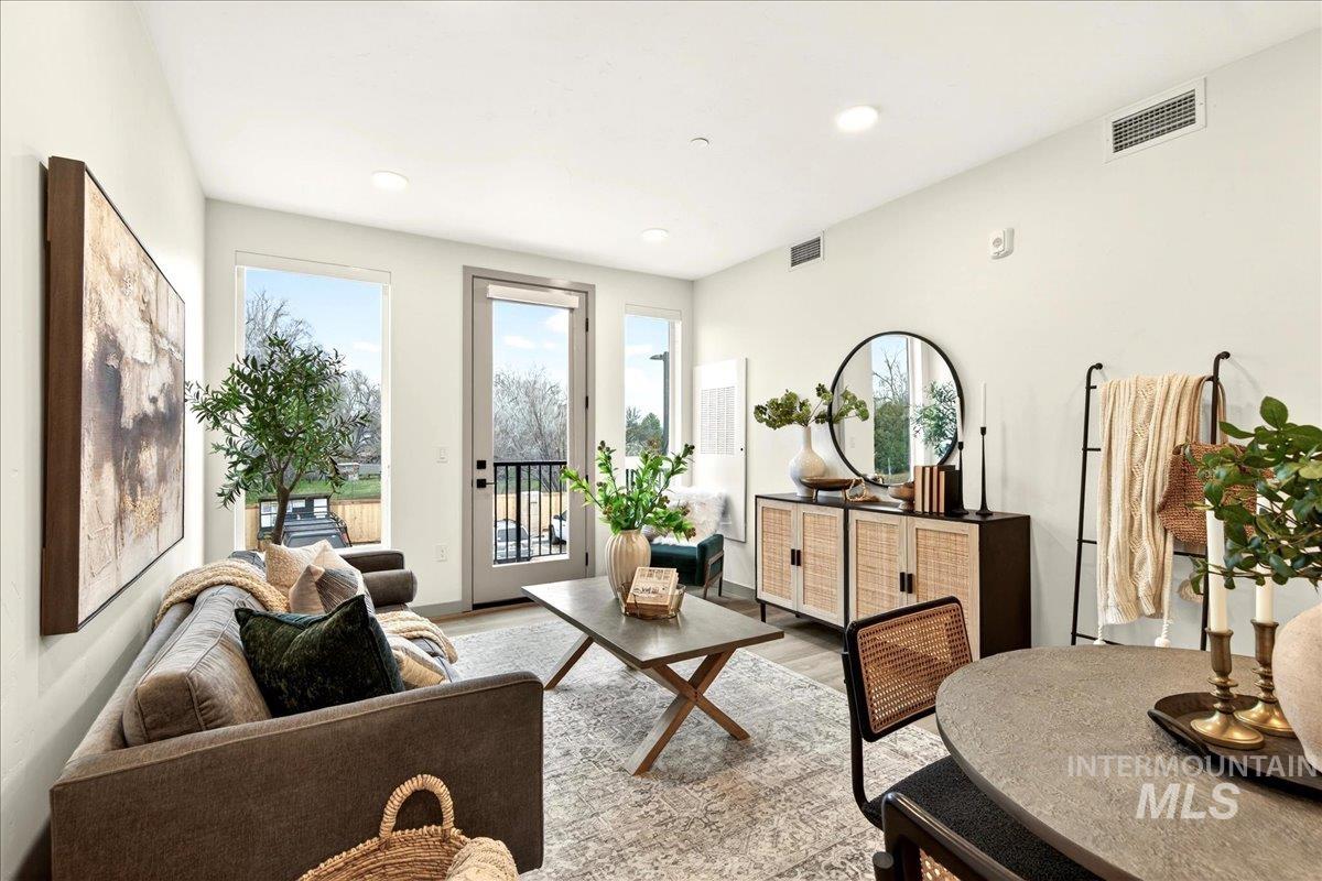 Living room featuring light wood finished floors and recessed lighting