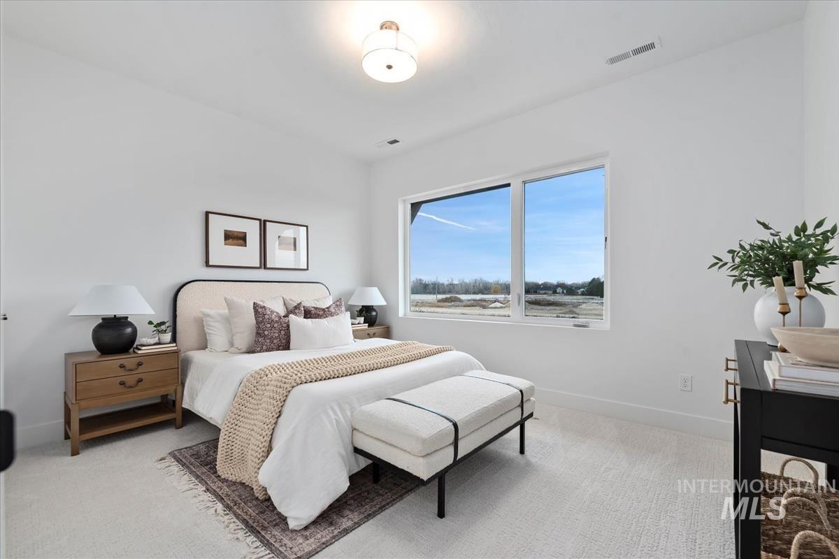 Bedroom with light carpet