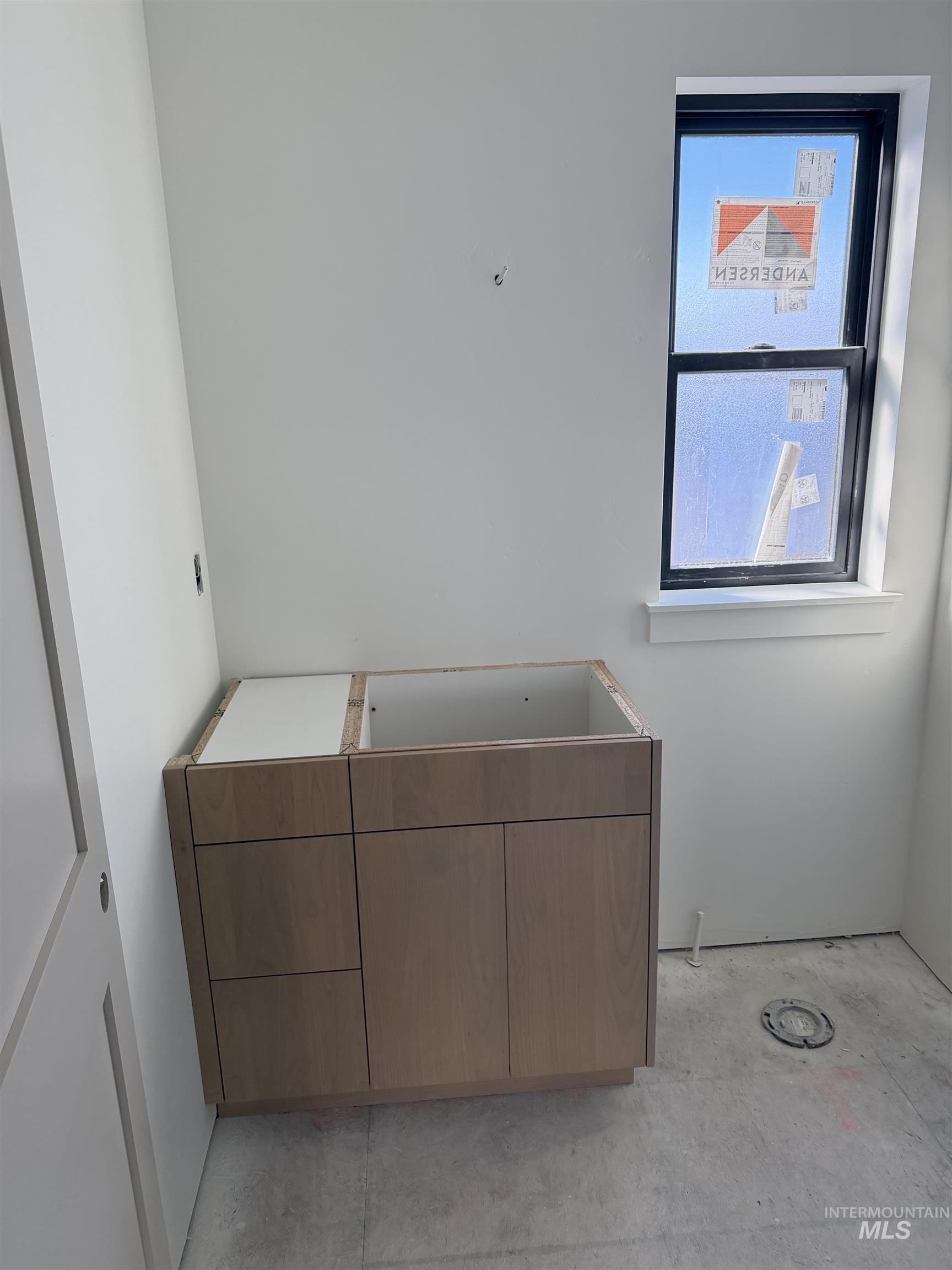 Bathroom with concrete flooring and vanity