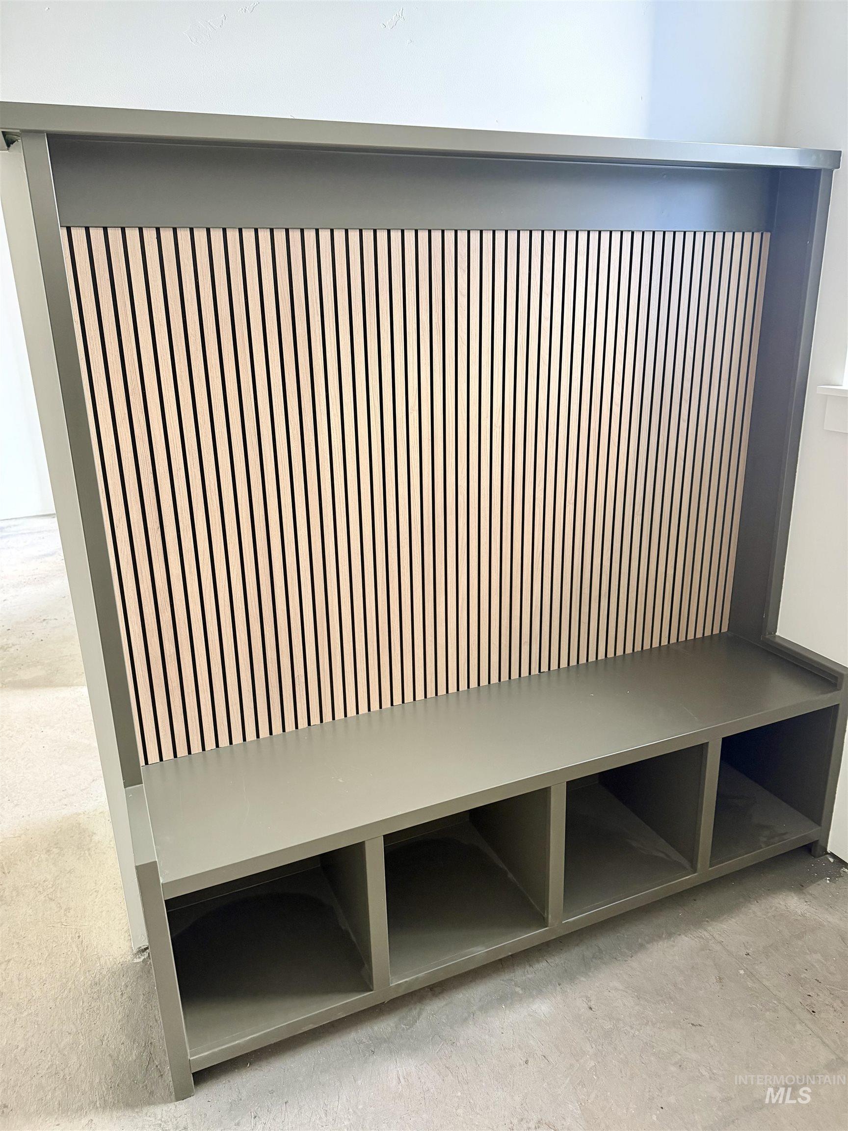 Mudroom with unfinished concrete flooring