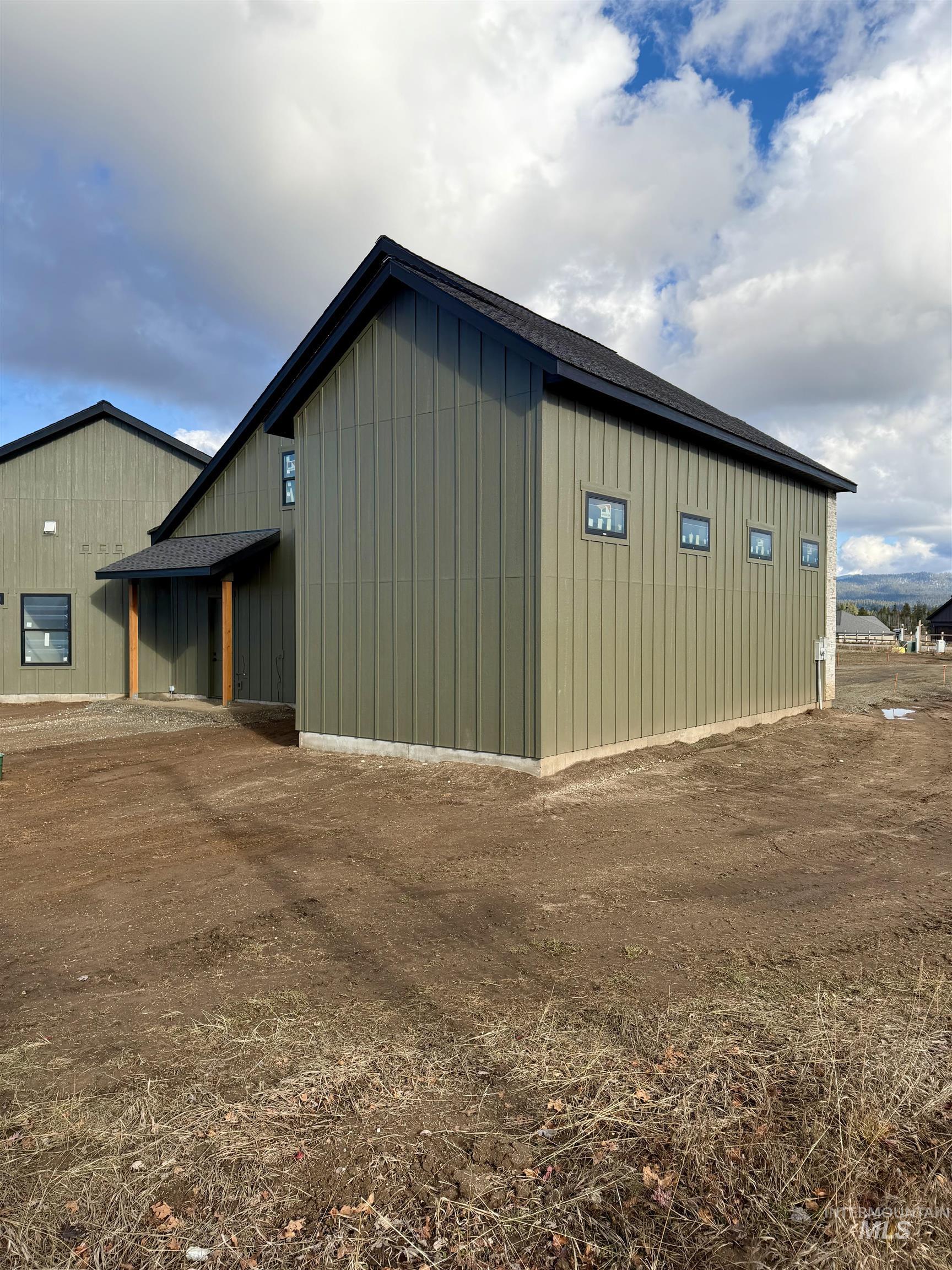 View of side of home featuring board and batten siding