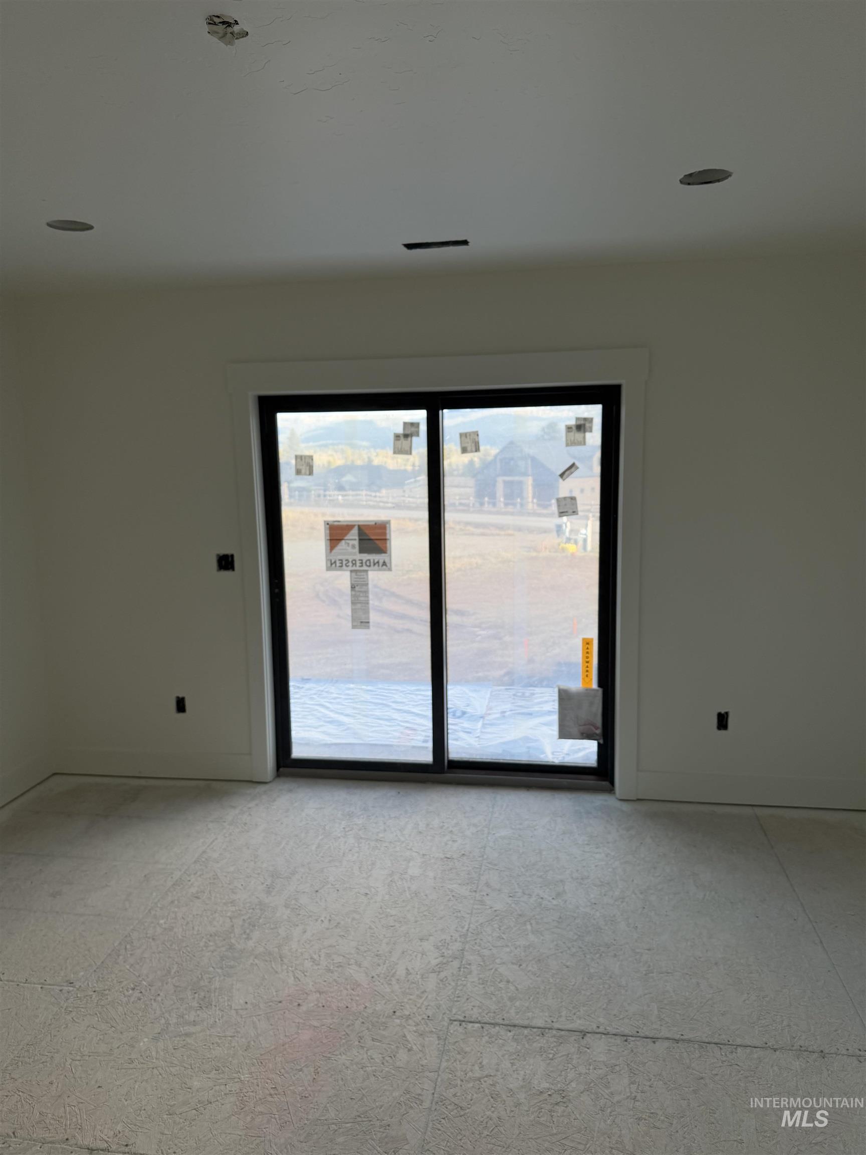 Unfurnished room with baseboards
