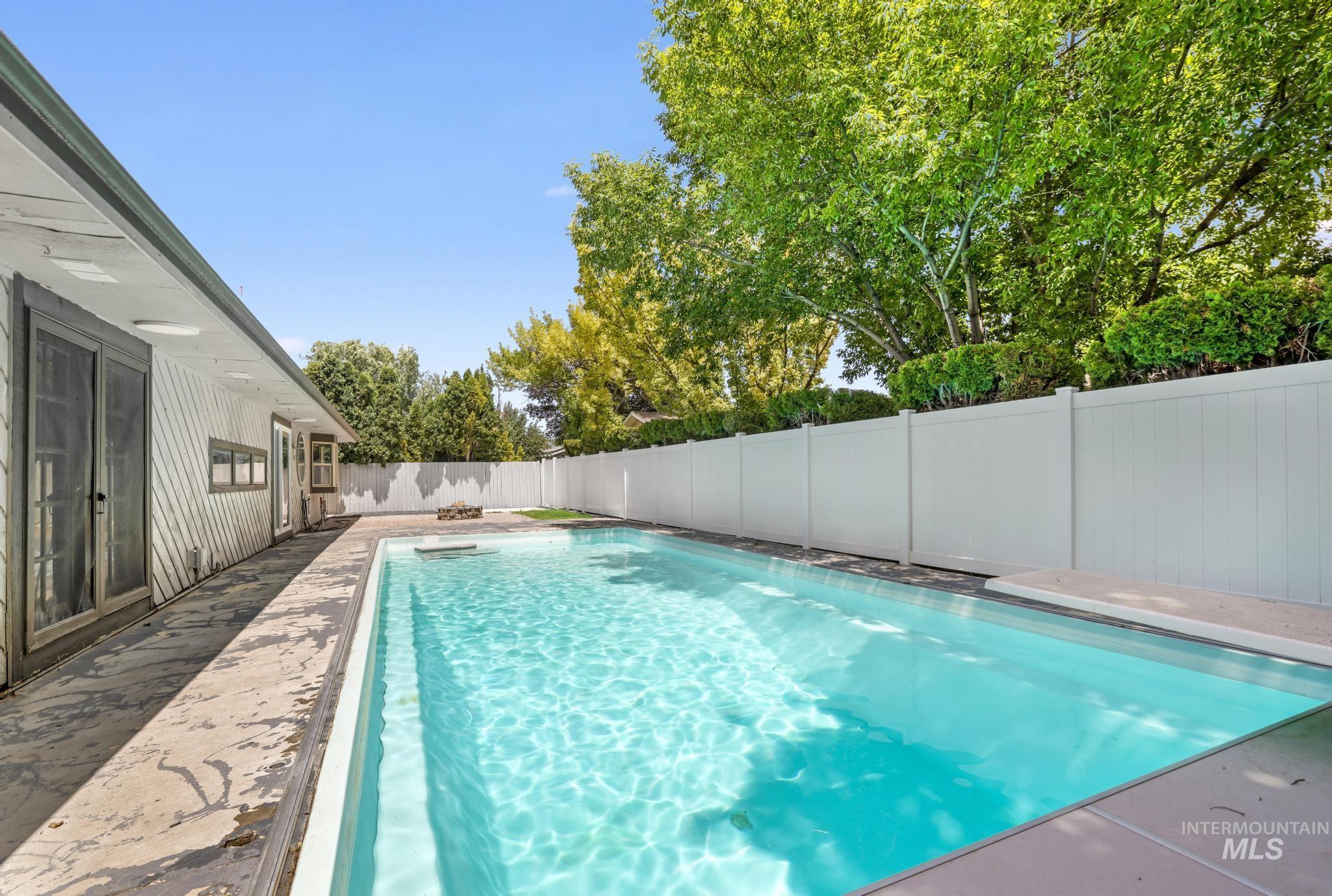 View of swimming pool featuring a fenced backyard