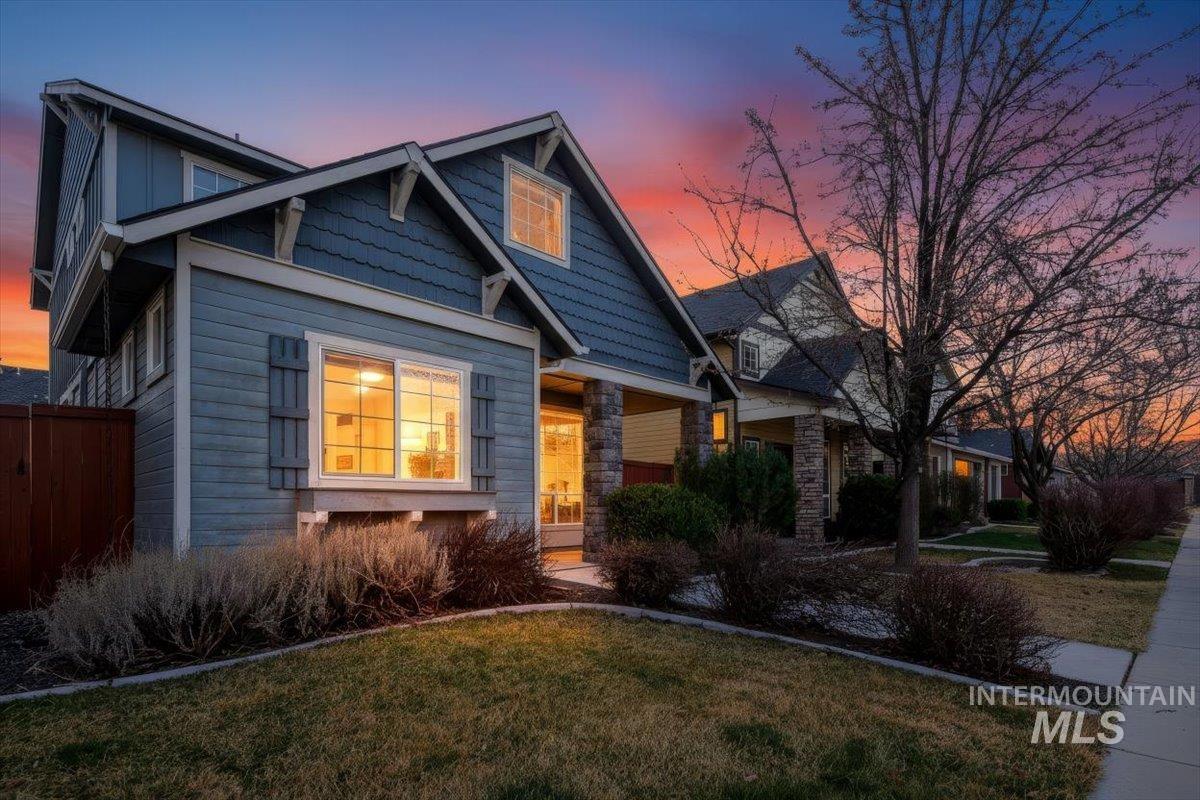 Craftsman-style home with stone siding