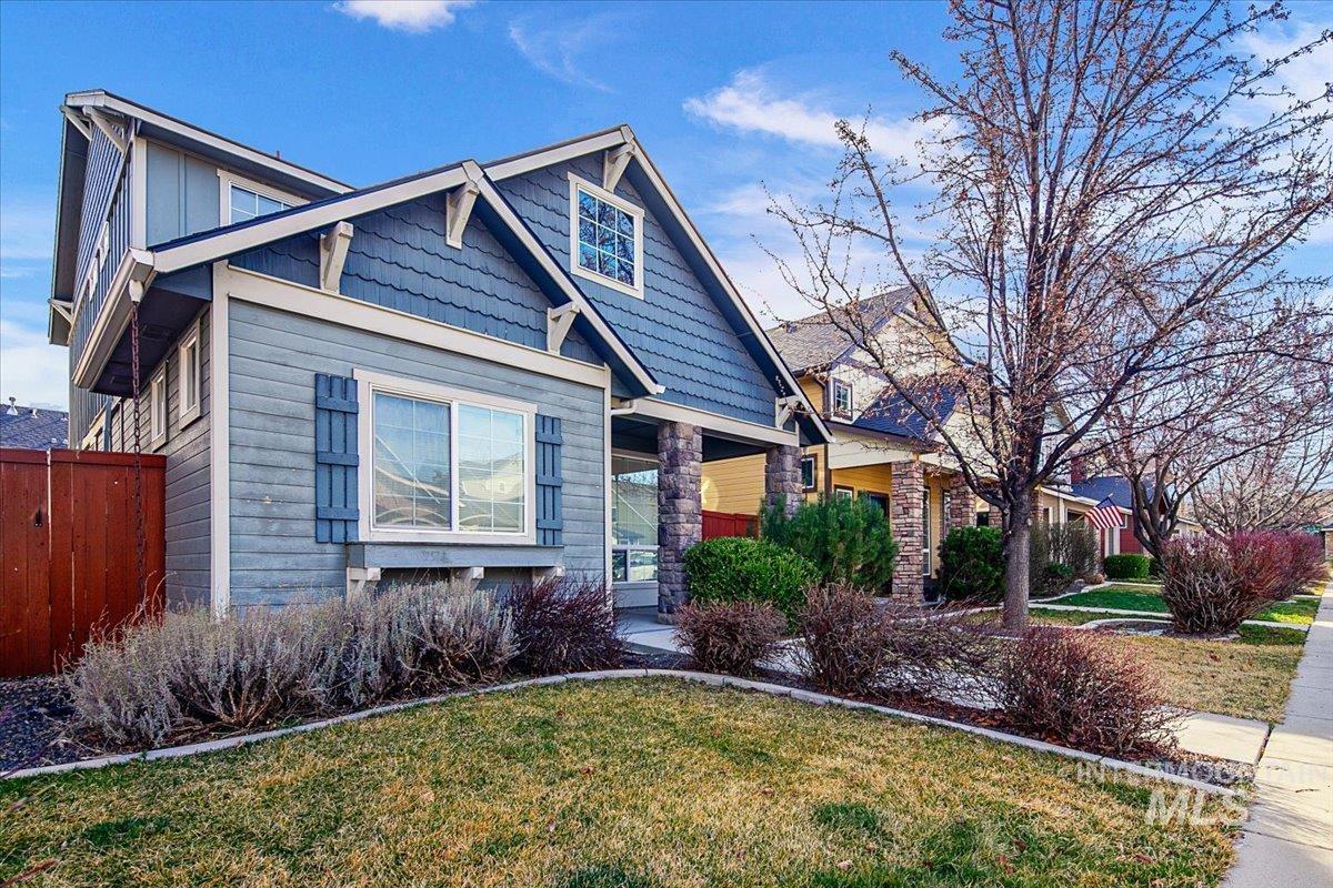 Craftsman-style house featuring stone siding