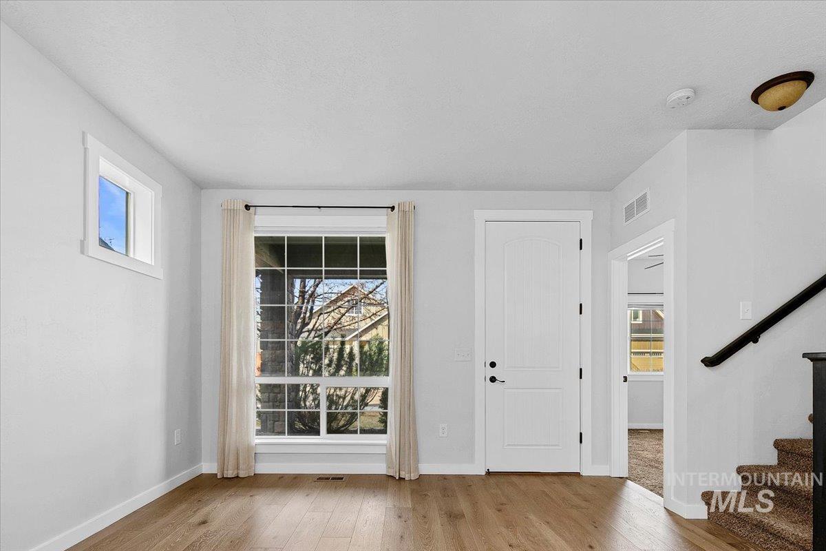Entrance foyer featuring light wood finished floors and plenty of natural light