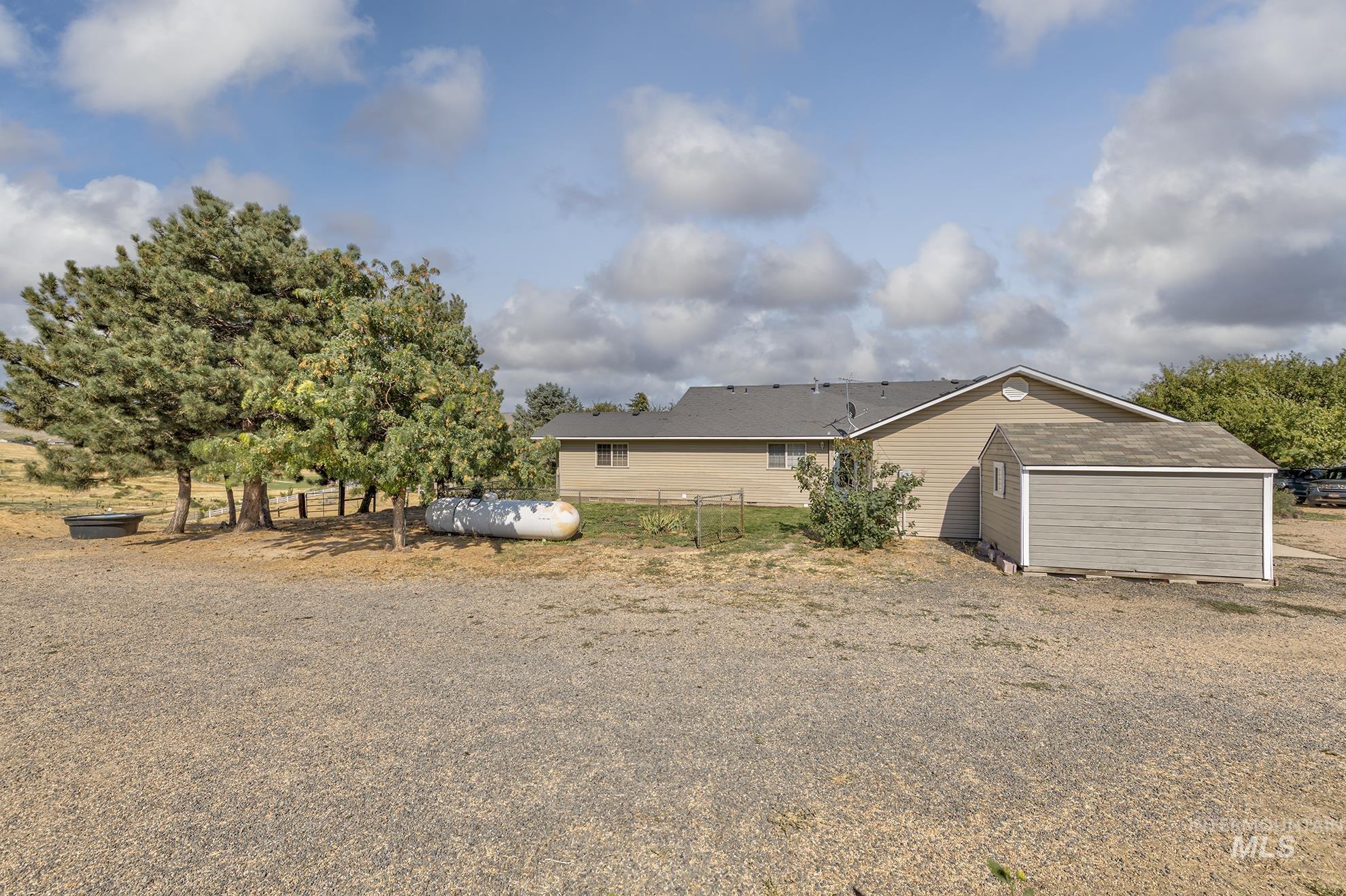 View of yard with a storage shed