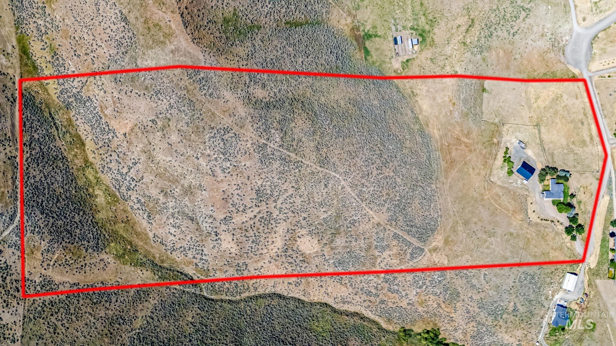 View of rural area with property boundaries highlighted and a desert landscape