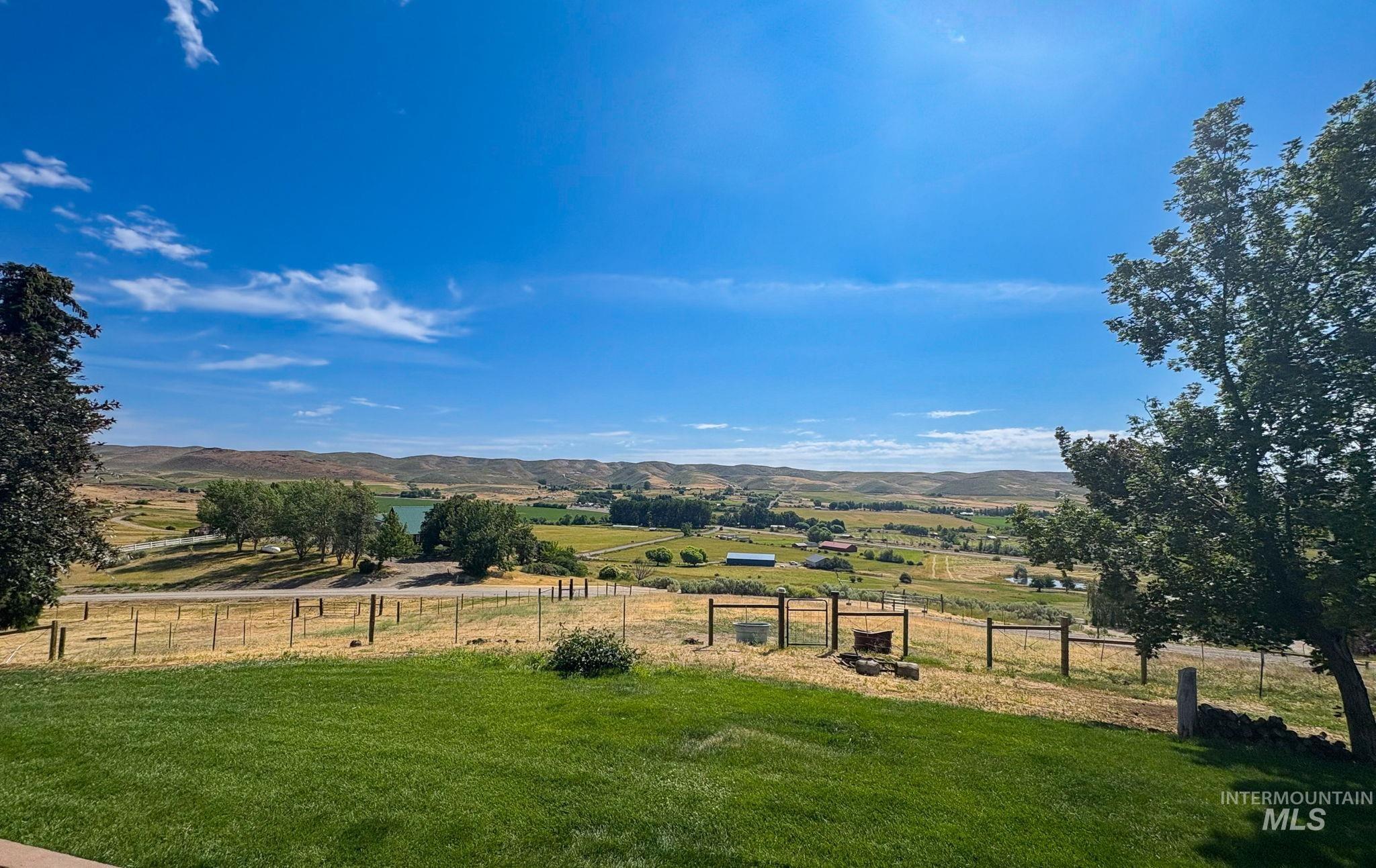 View of yard with a view of rural / pastoral area and a mountain view