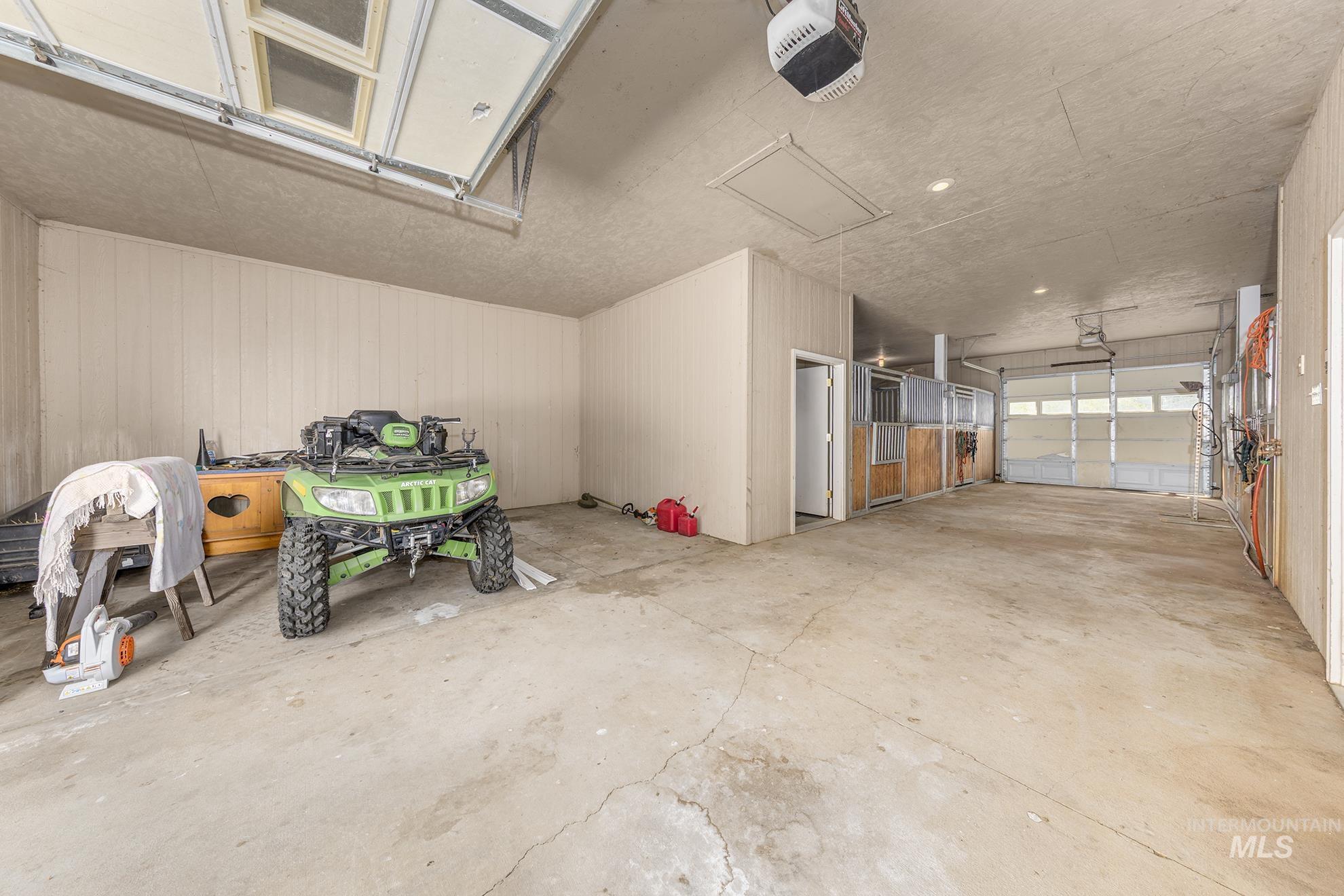 Garage featuring a garage door opener