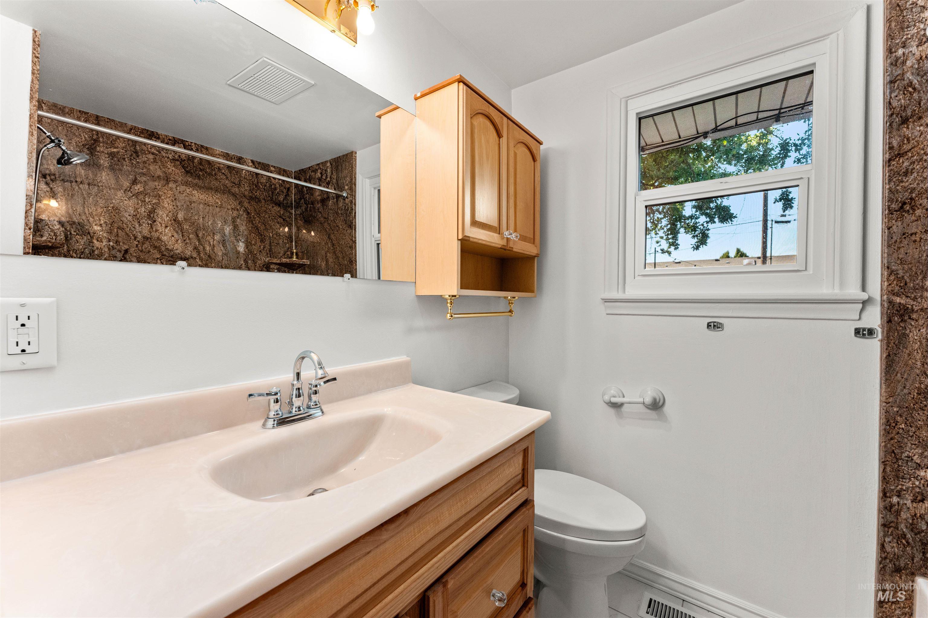 Full bath featuring vanity and a shower with shower curtain