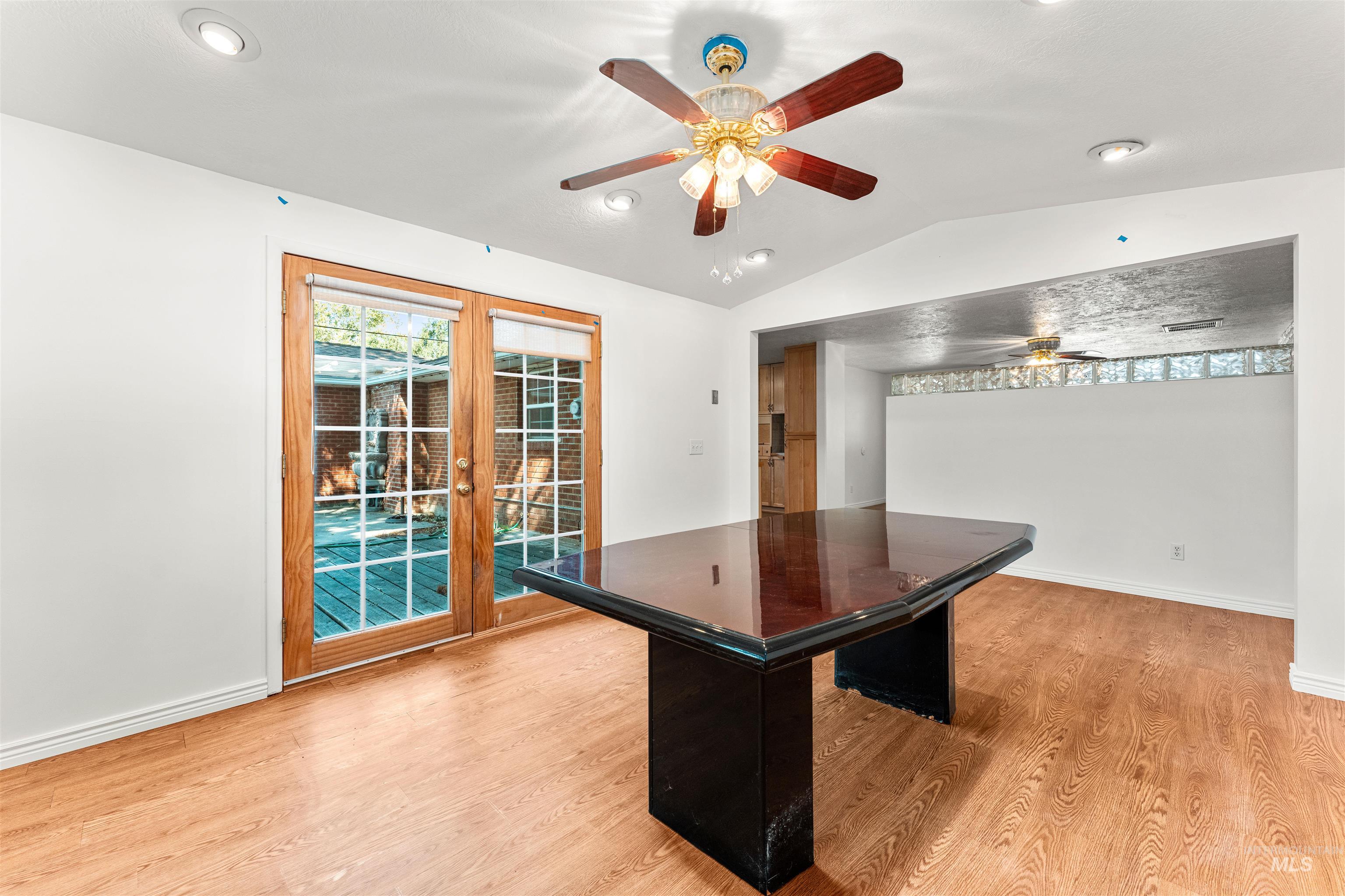 Playroom with lofted ceiling, light wood-type flooring, ceiling fan, french doors, and recessed lighting