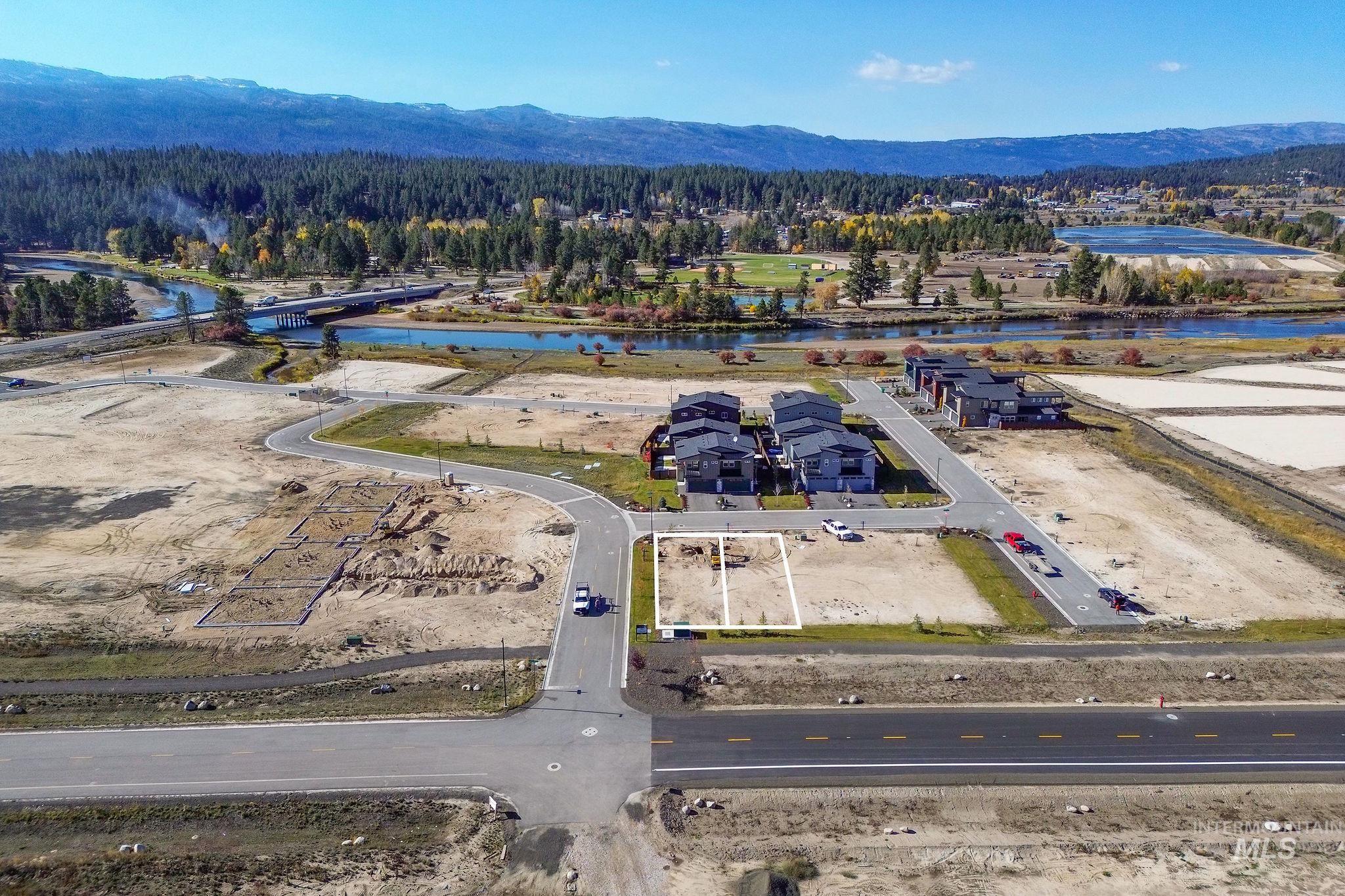 Drone / aerial view of a water and mountain view and a heavily wooded area