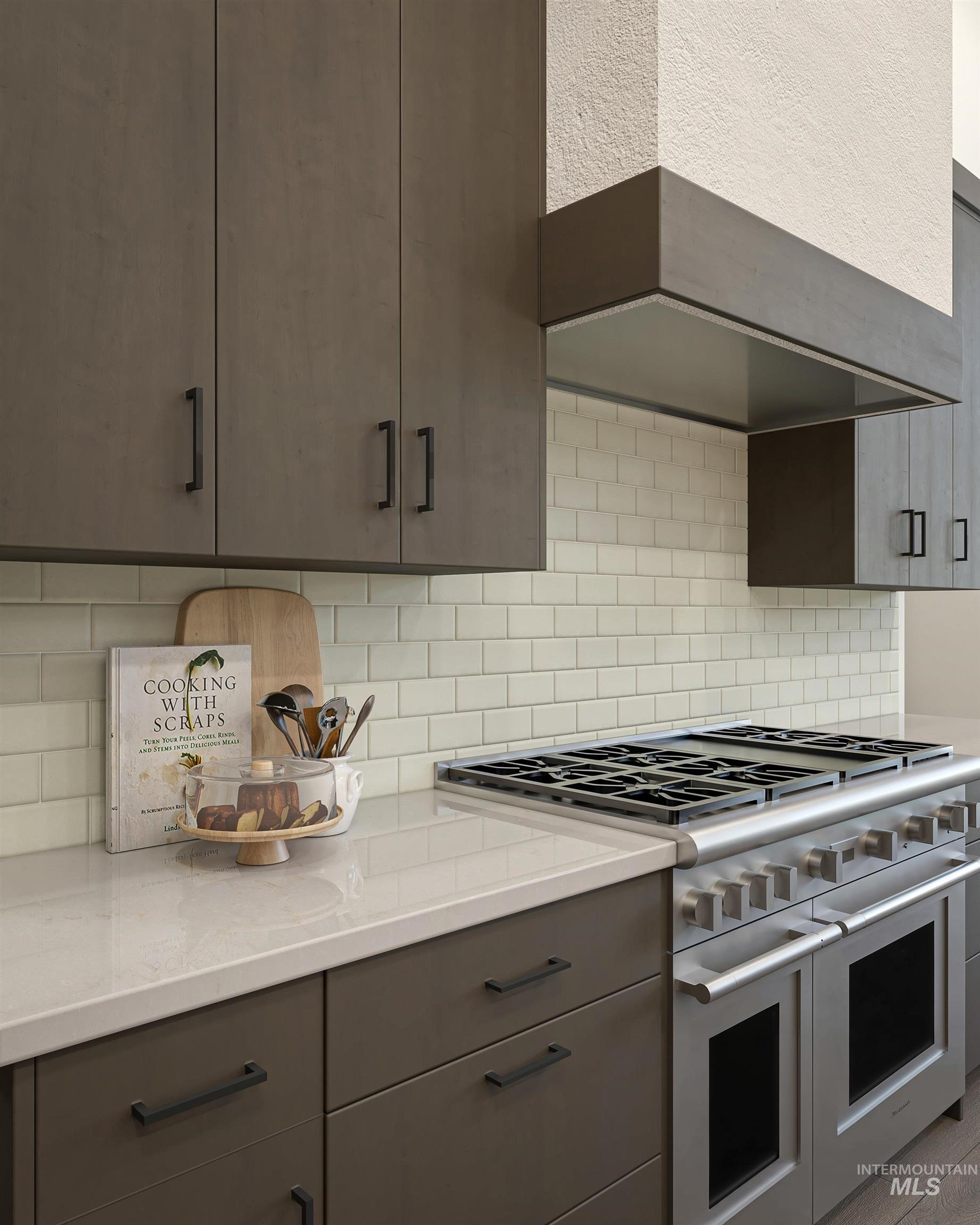 Digital Rendering. Contemporary kitchen featuring flat-panel cabinetry with matte black hardware, subway tile backsplash, and a professional-grade stainless steel range with double ovens