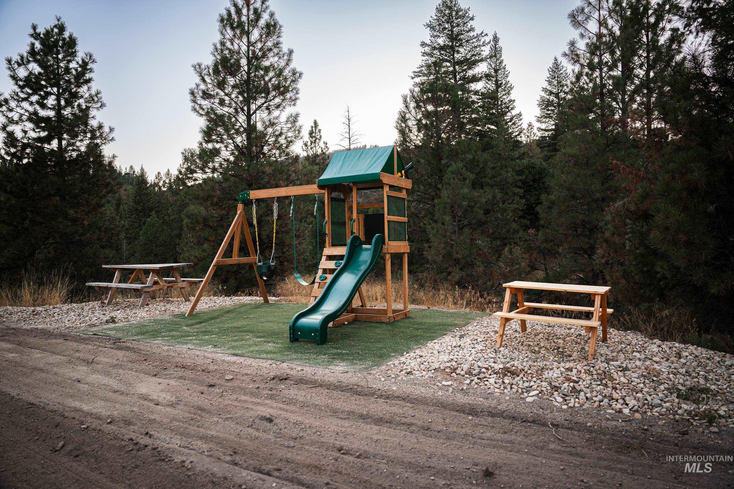 View of play area featuring a view of trees
