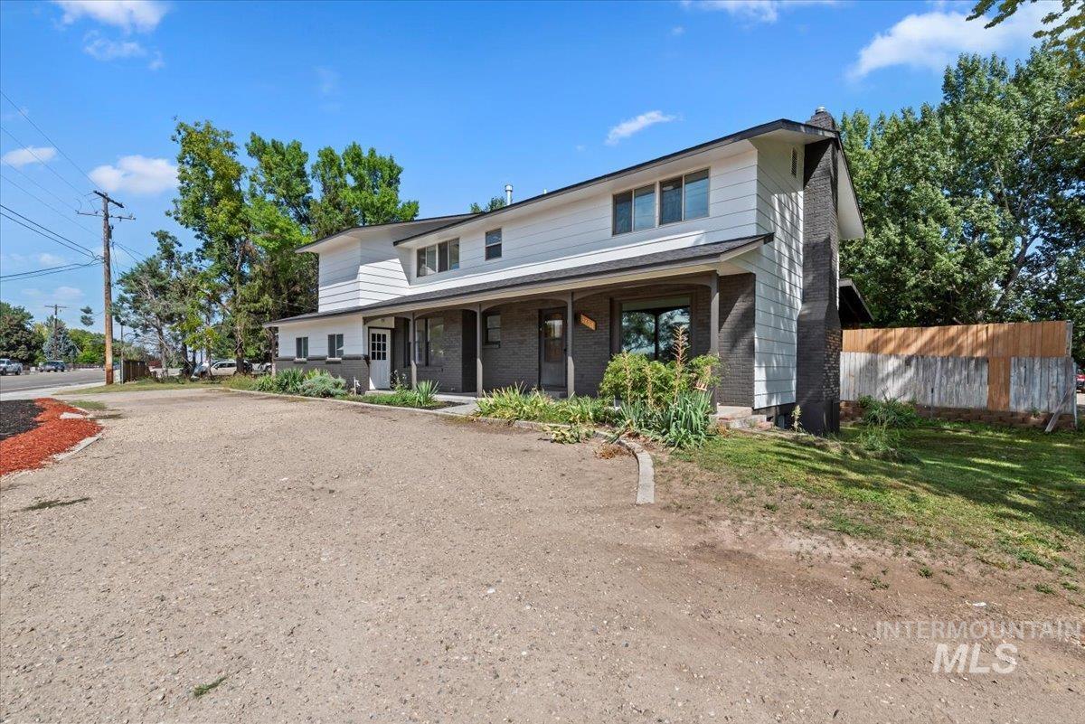 Traditional-style house featuring covered porch