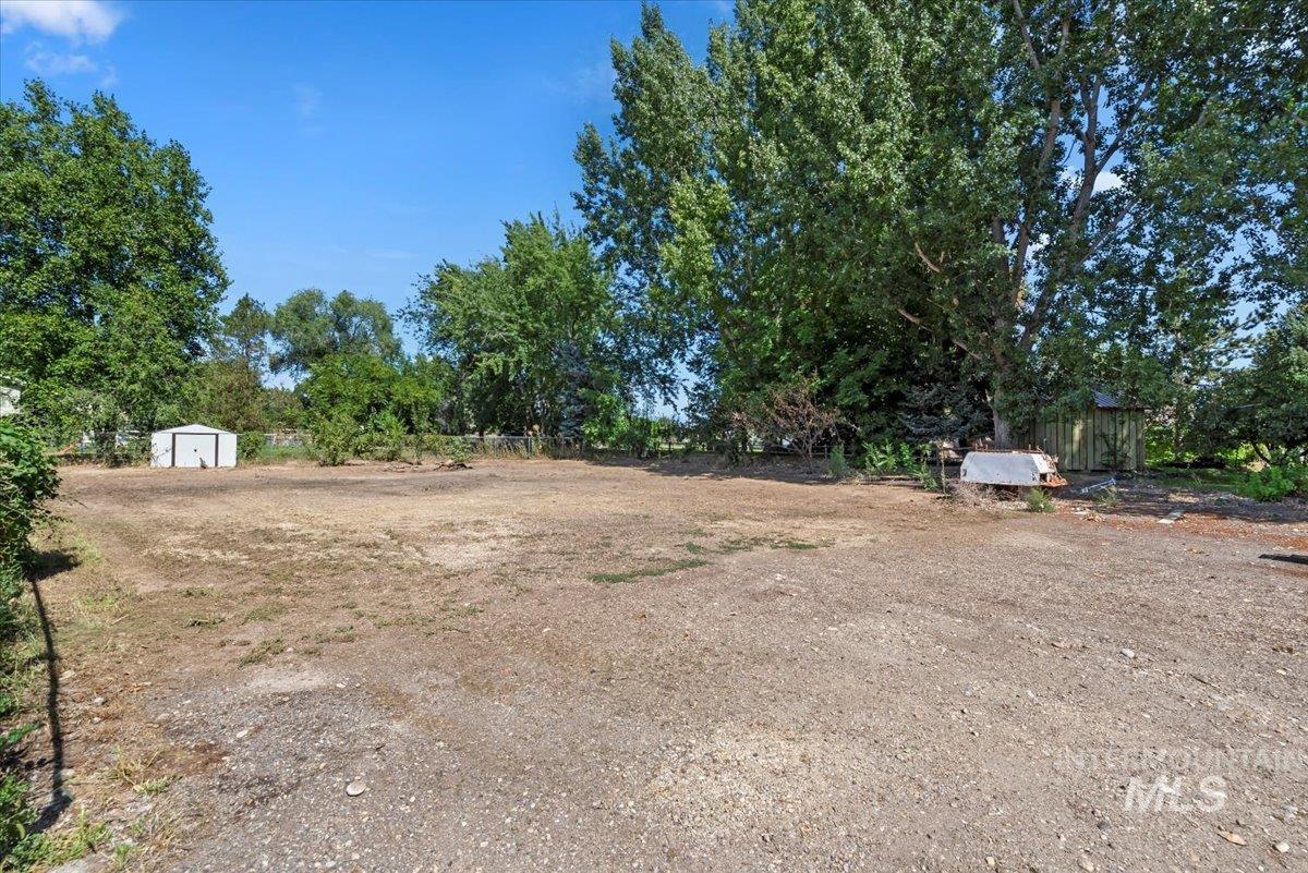 Potential for garden and fruit trees w/ storage unit