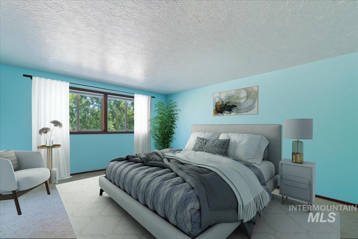 Master Bedroom featuring carpet flooring and a textured ceiling