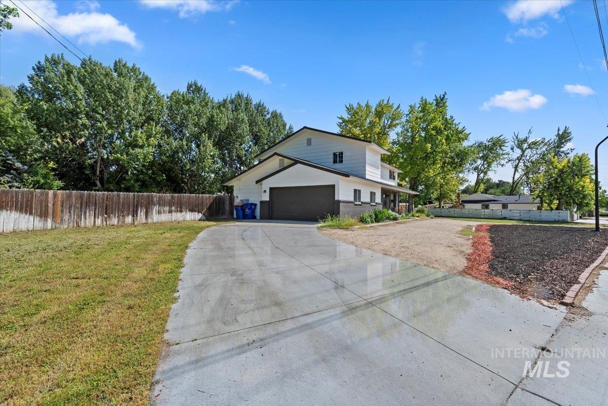 Traditional home featuring driveway and a garage