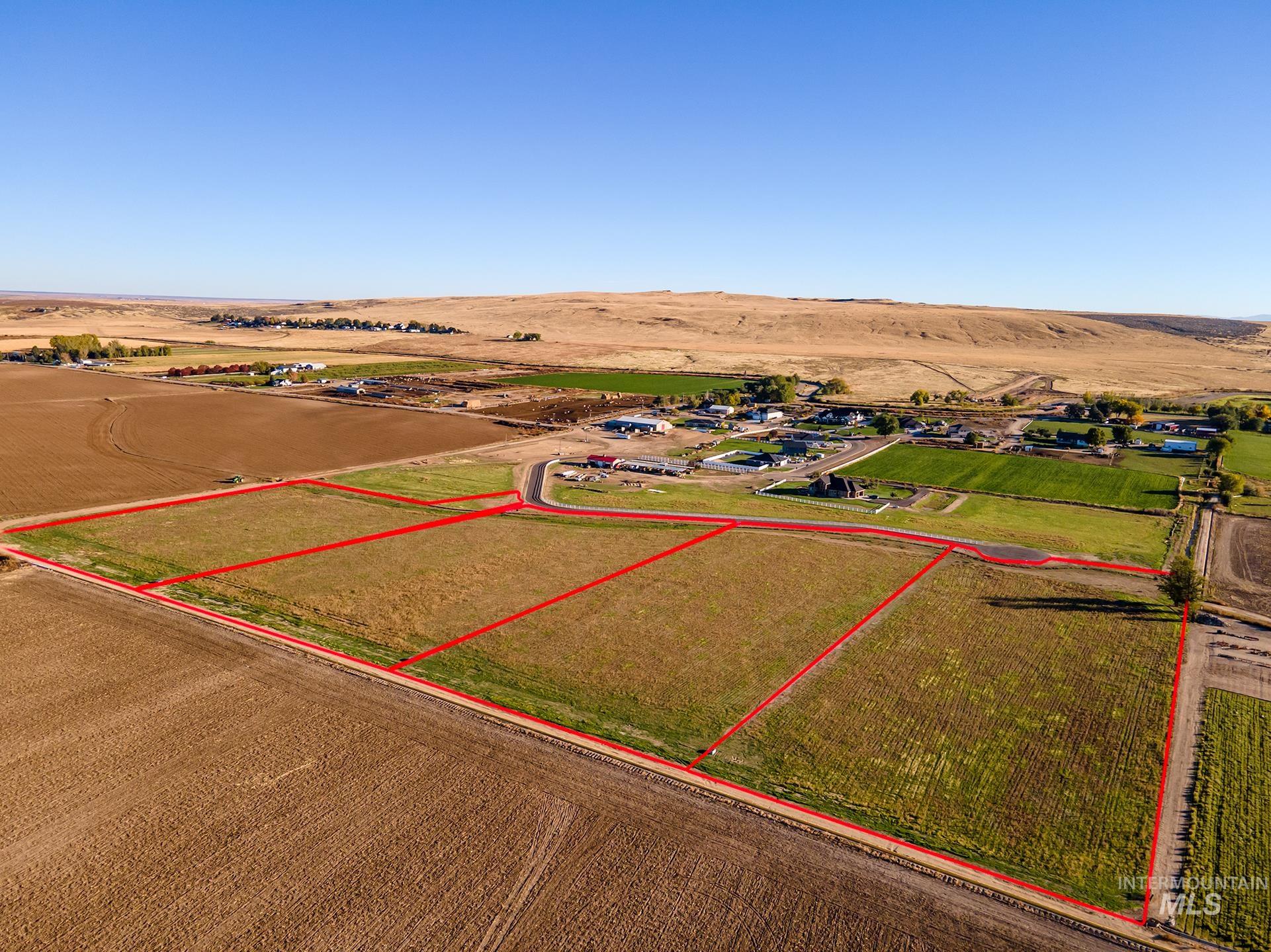Aerial view of sparsely populated area featuring property boundaries highlighted