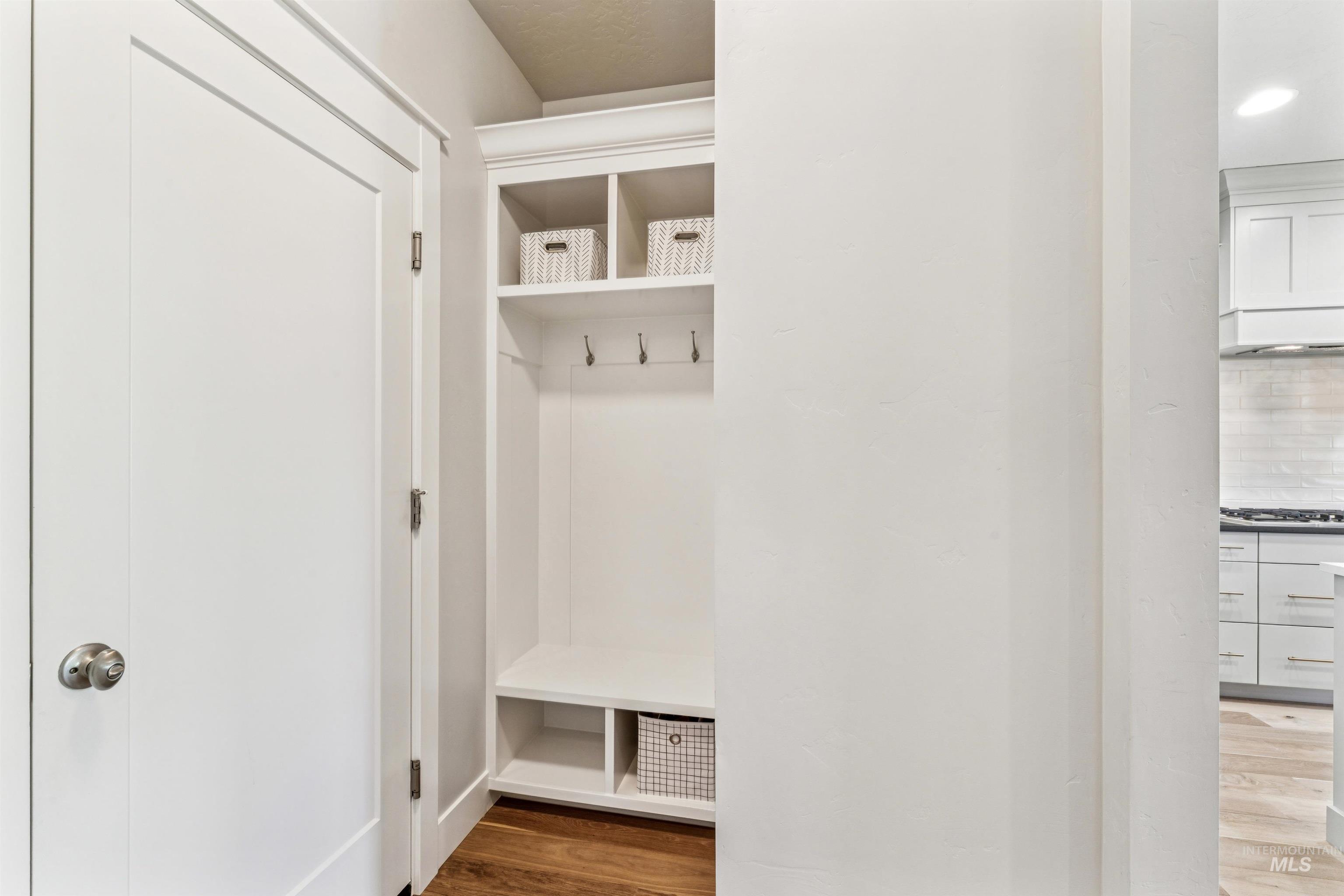 Mudroom featuring light wood-style flooring