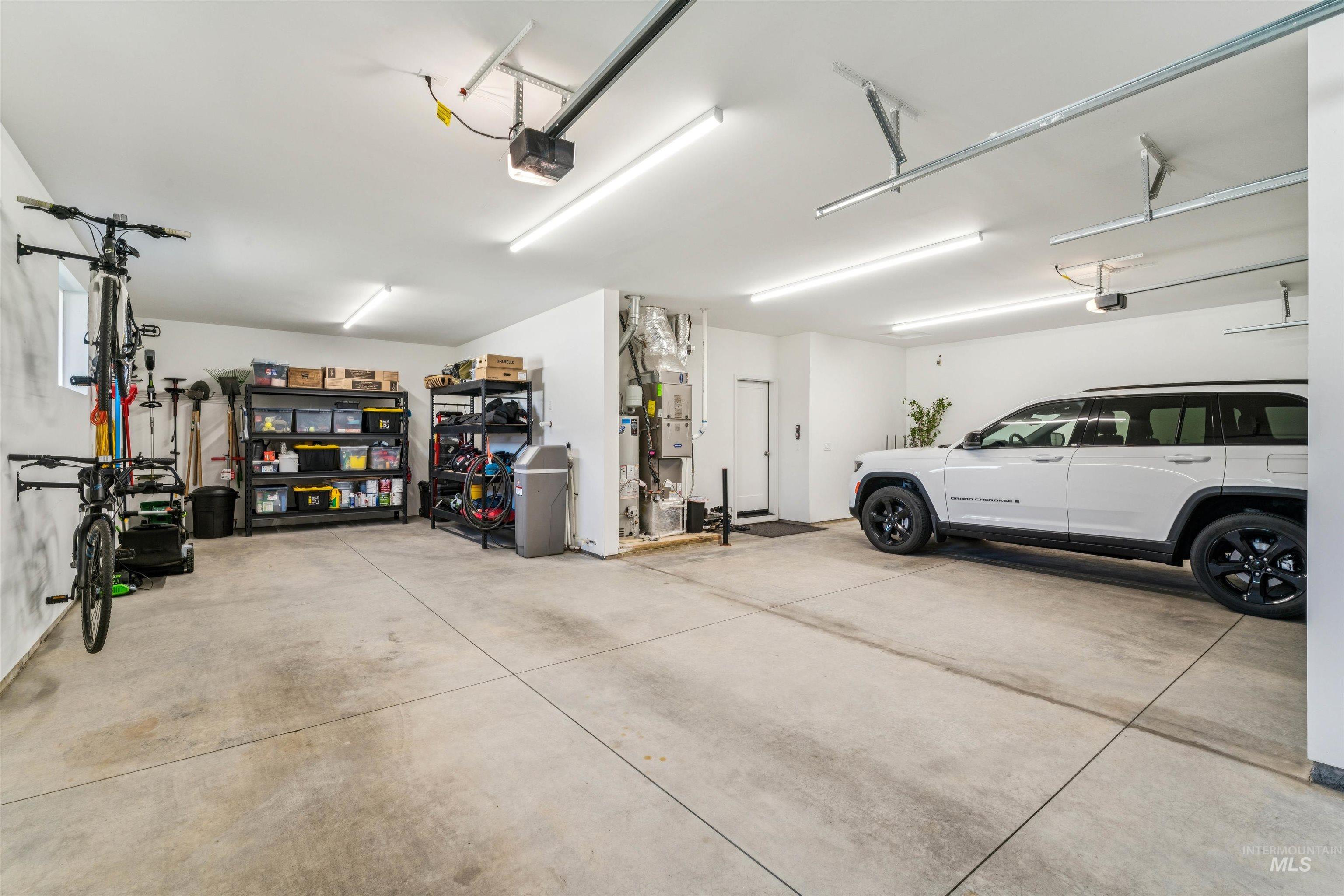Garage featuring a garage door opener