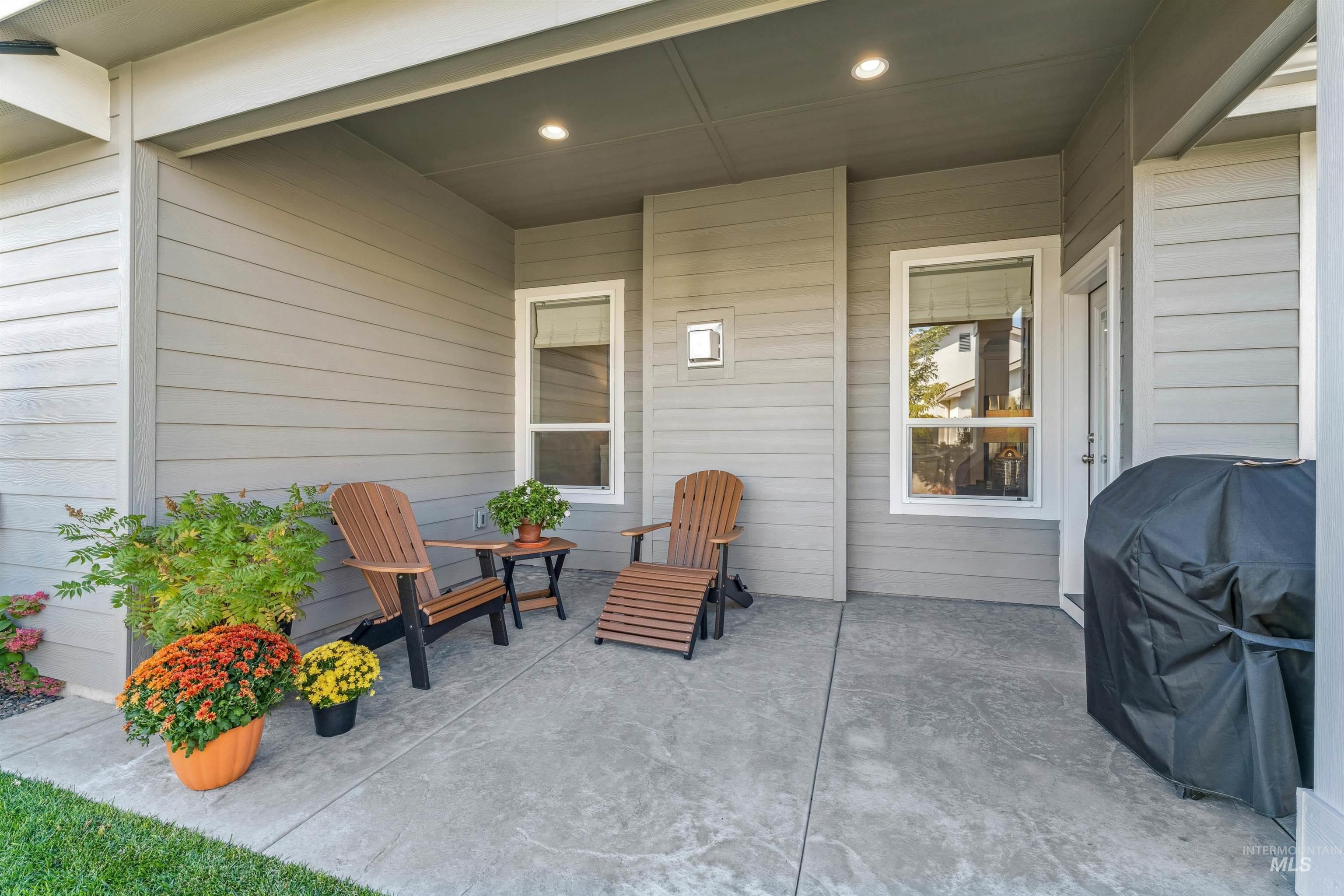 View of patio featuring a grill