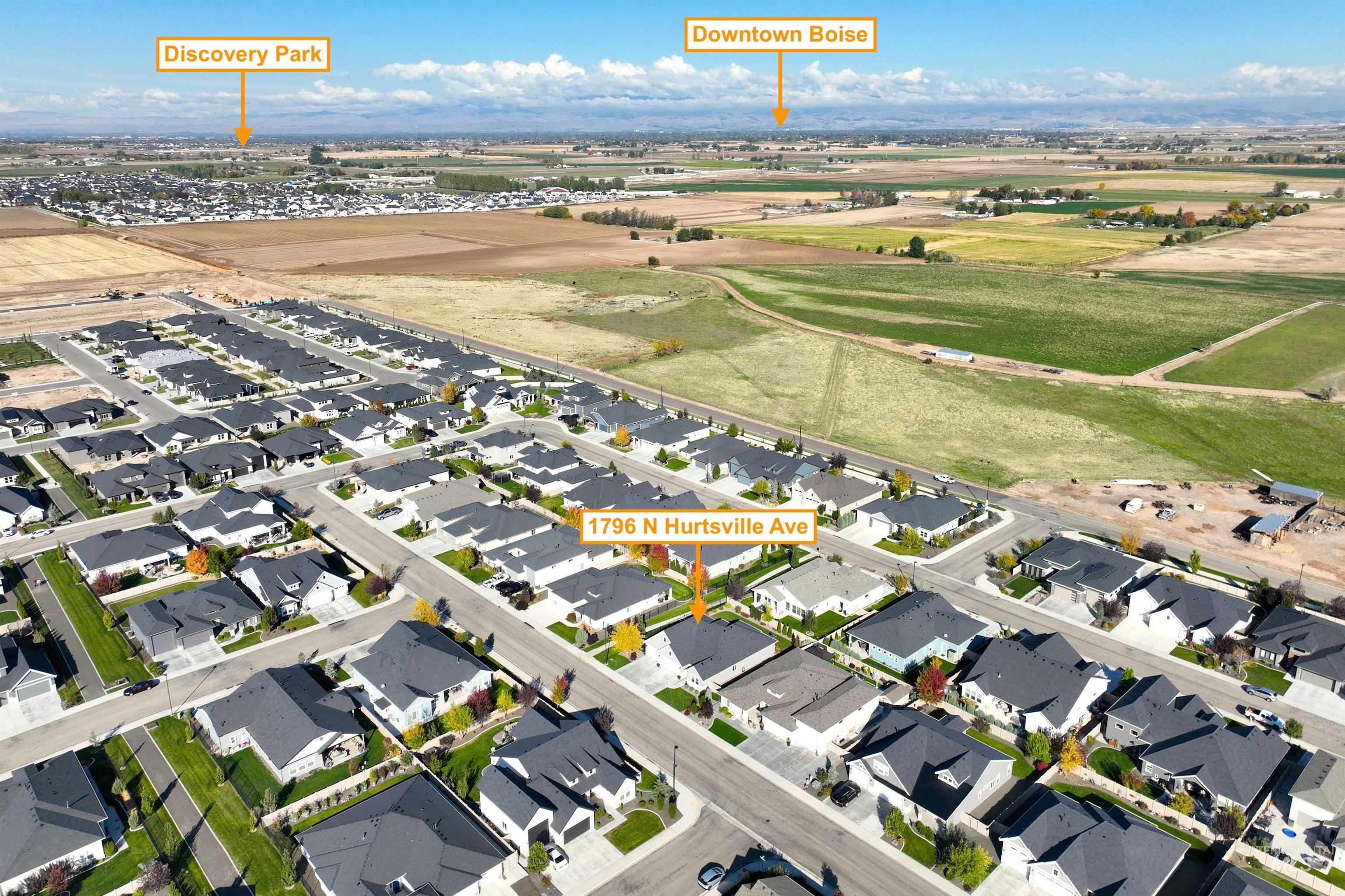 Aerial overview of property's location featuring nearby suburban area