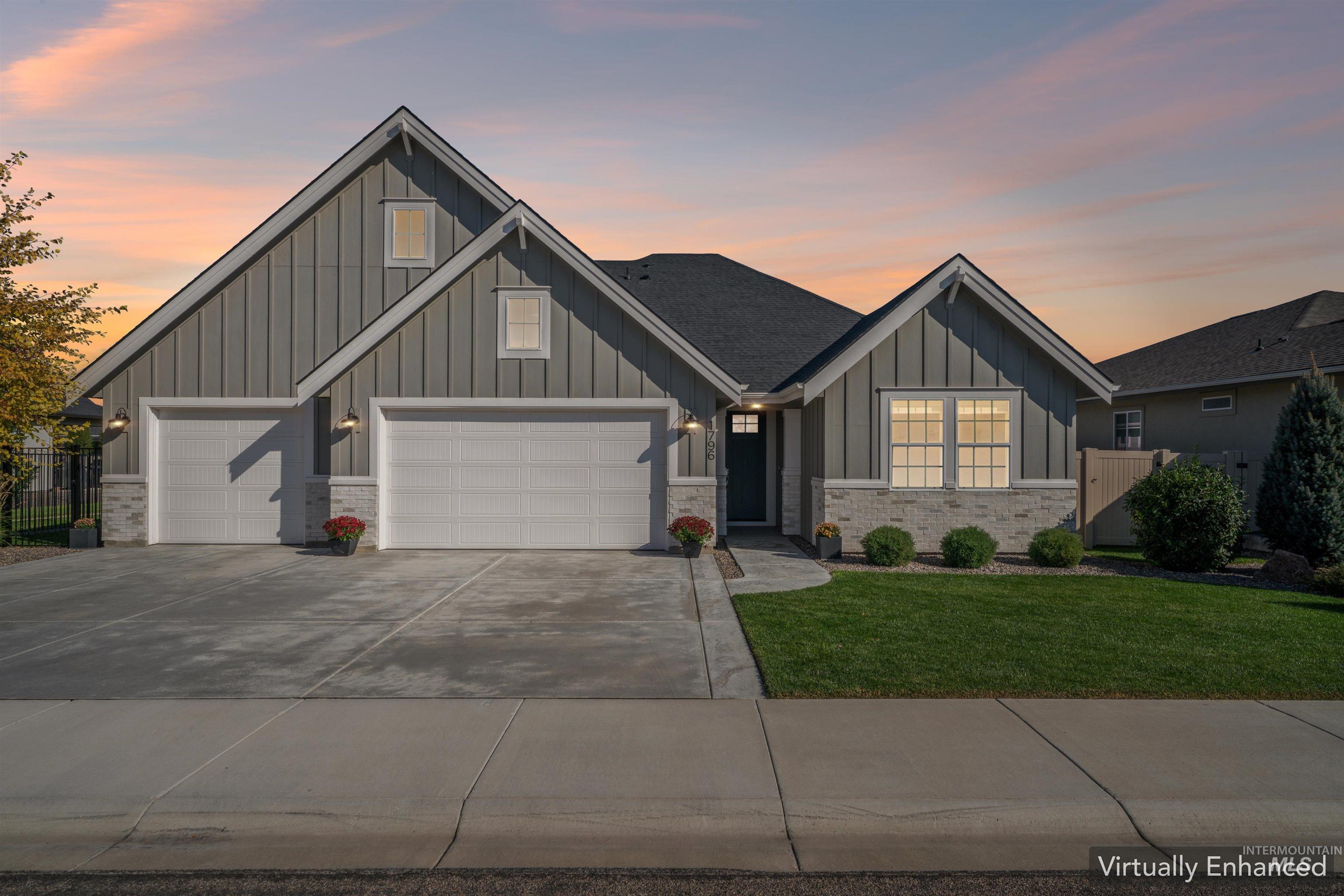 Craftsman-style house with board and batten siding and concrete driveway