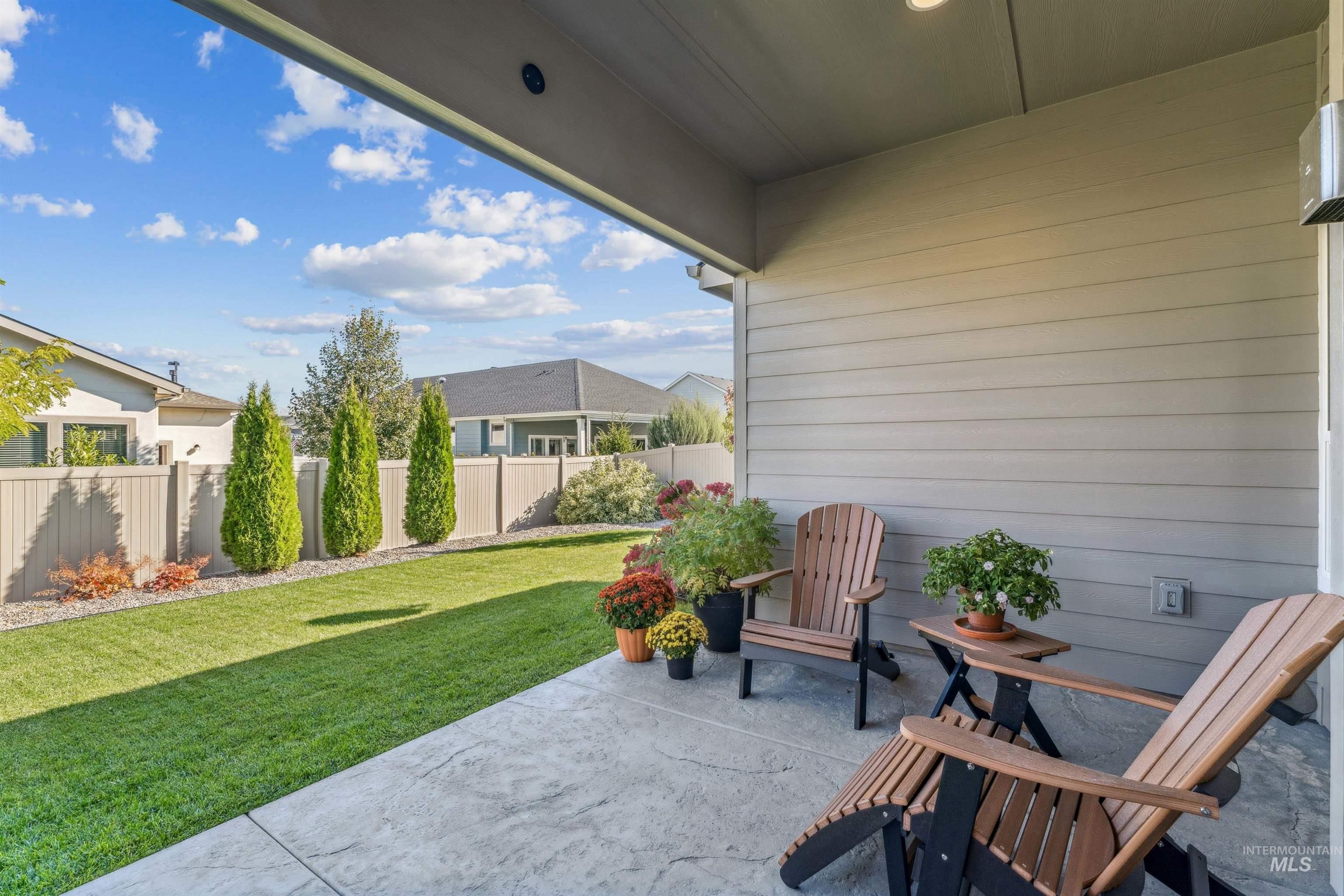 Fenced backyard with a patio area