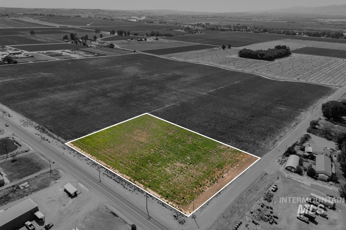 Overview of rural landscape featuring property boundaries highlighted and farmland