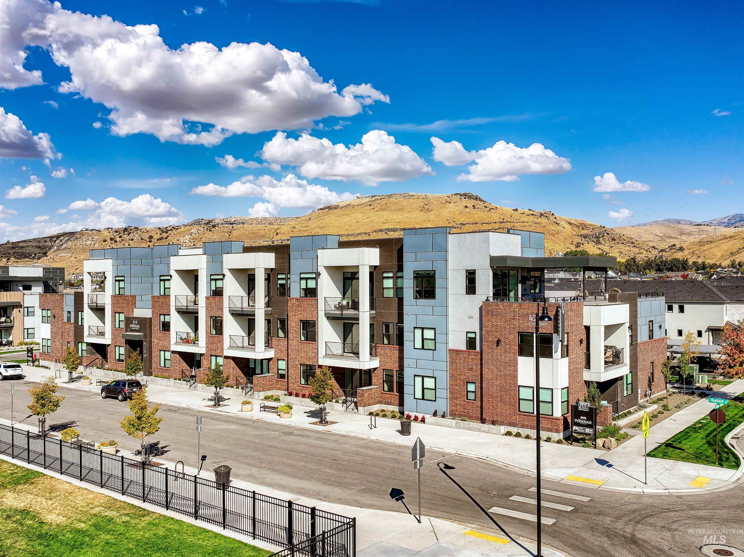 View of property featuring a mountain view and a residential view