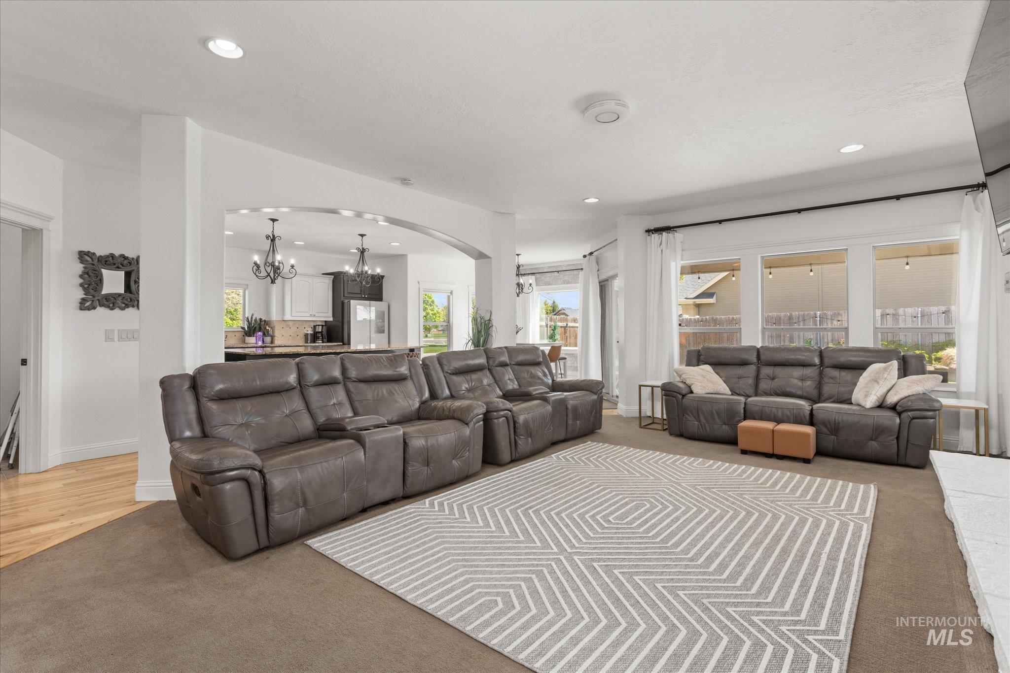 Spacious living area featuring recessed lighting and wall-to-wall carpeting