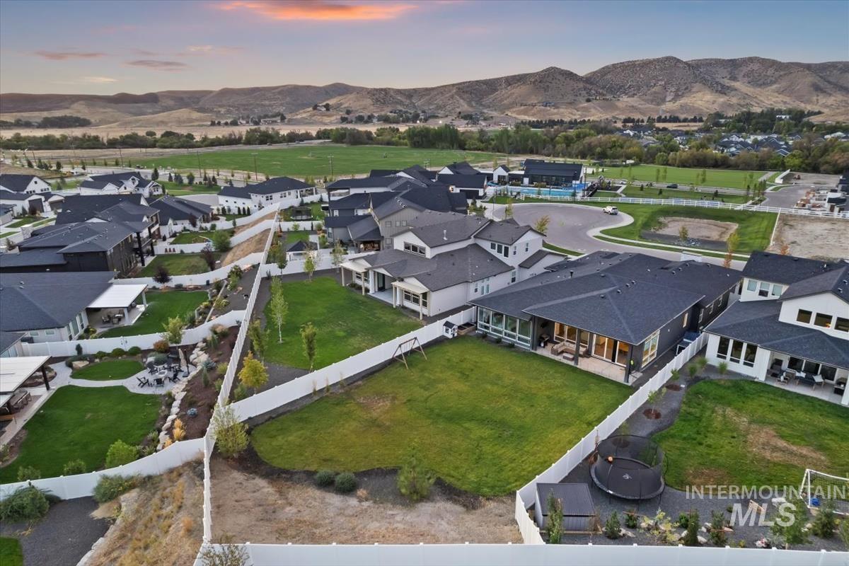 Aerial view at dusk of a residential view and a mountain view