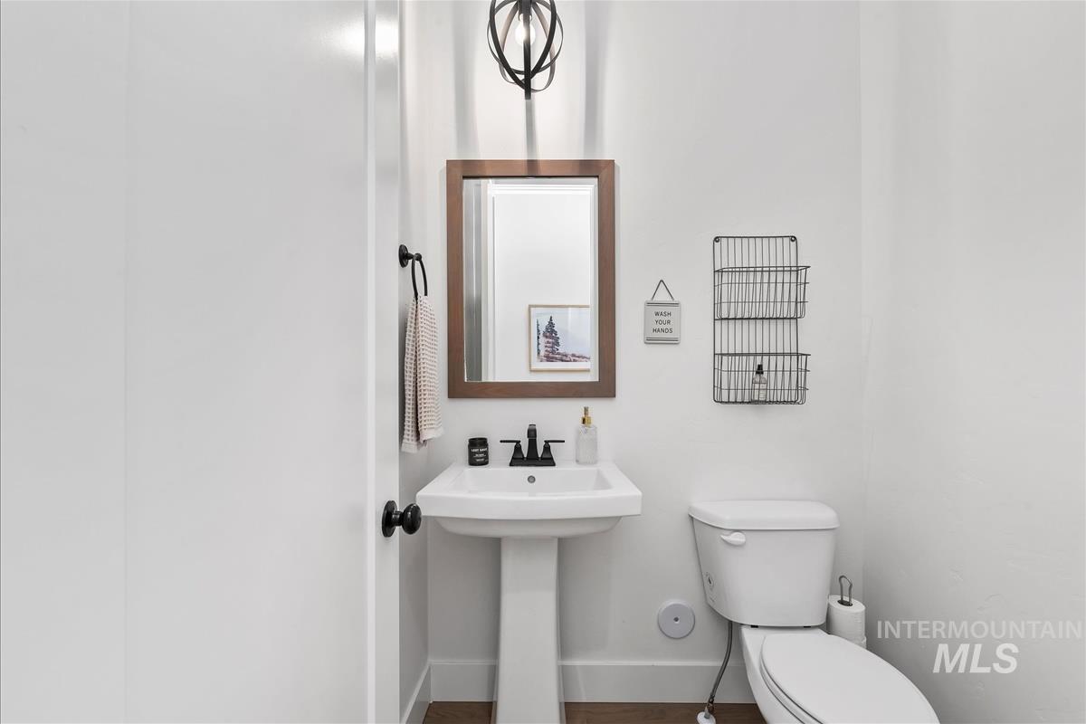 Bathroom featuring toilet and baseboards