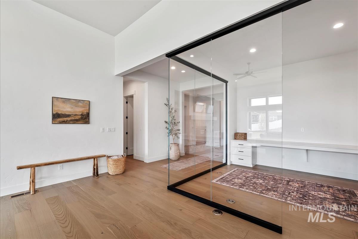 Interior space featuring wood finished floors, recessed lighting, and ceiling fan