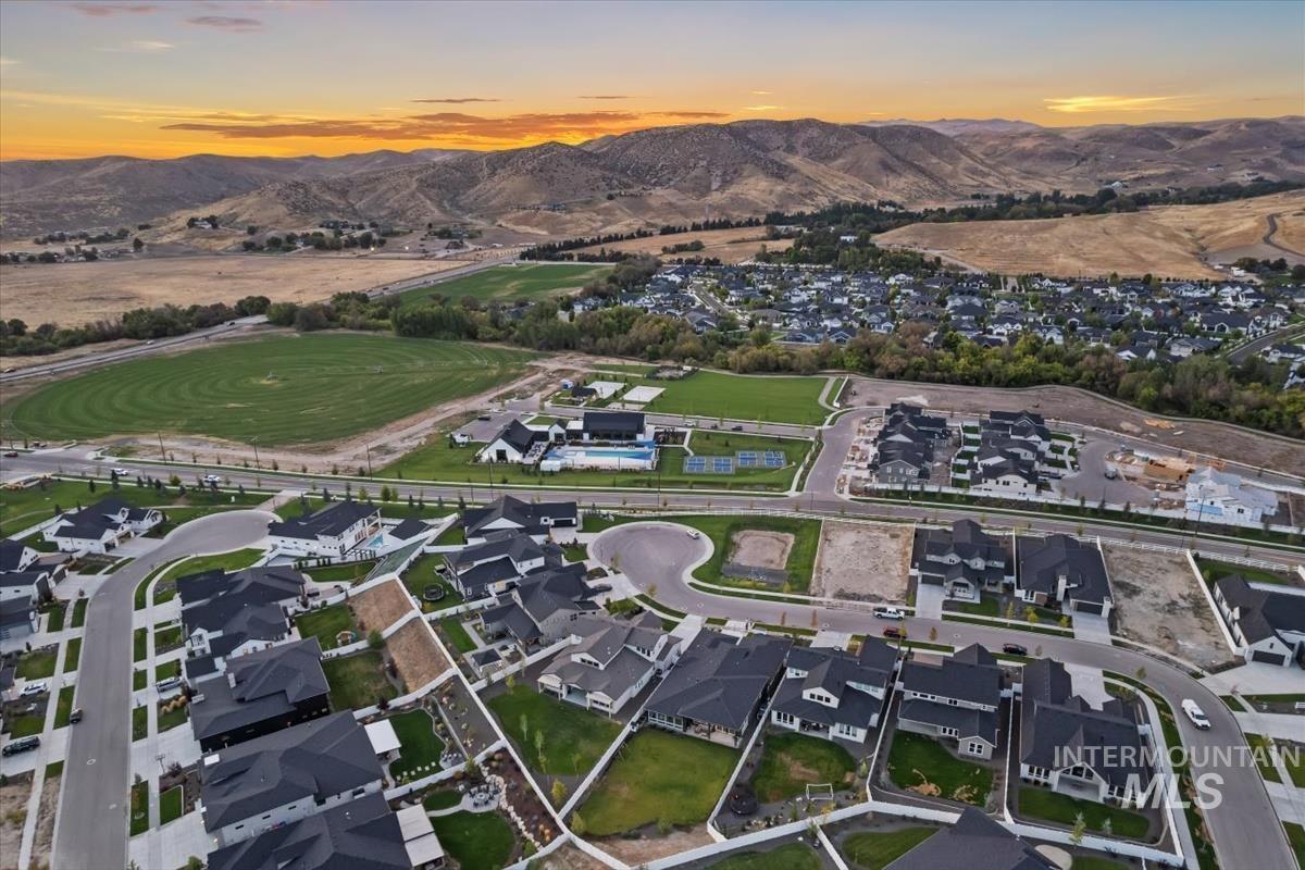 Aerial view at dusk of a residential view and a mountain view