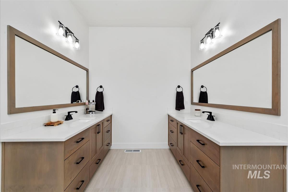 Full bath with two vanities