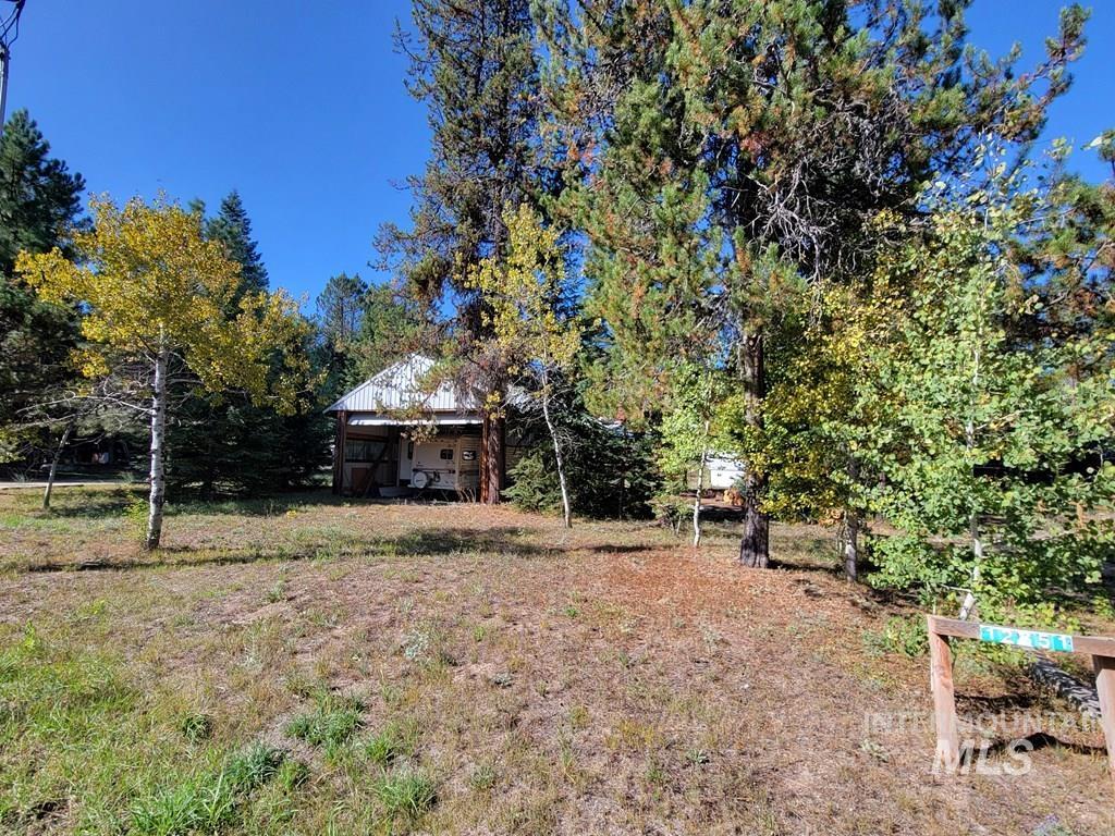 View of yard with view of wooded area