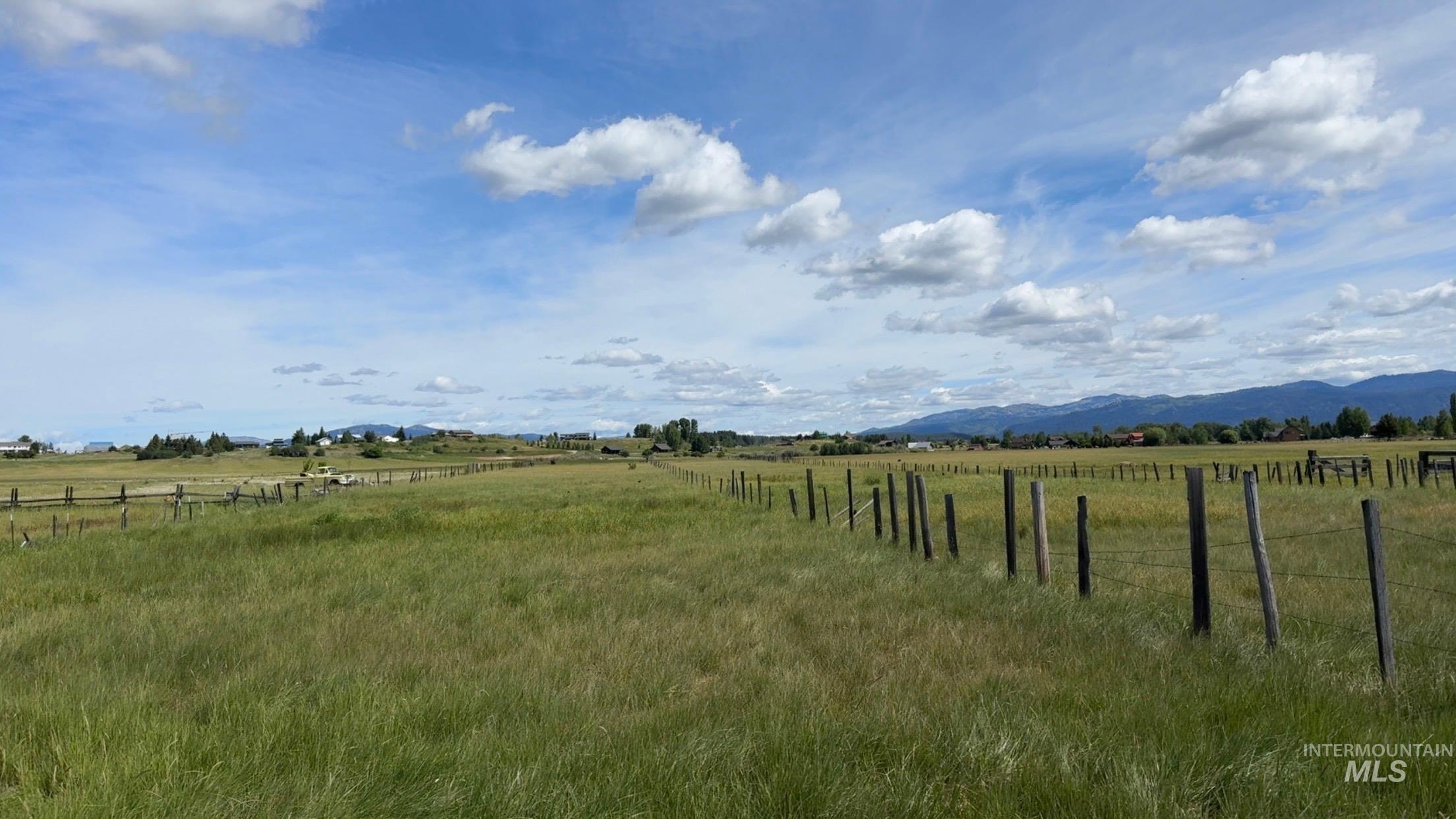 View of yard featuring a view of rural / pastoral area and a mountain view