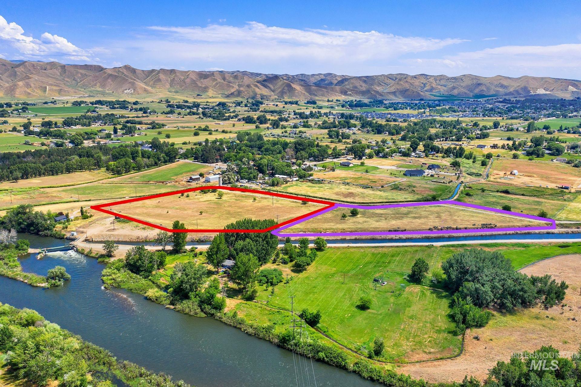 Overview of rural landscape featuring property parcel outlined and a water and mountain view