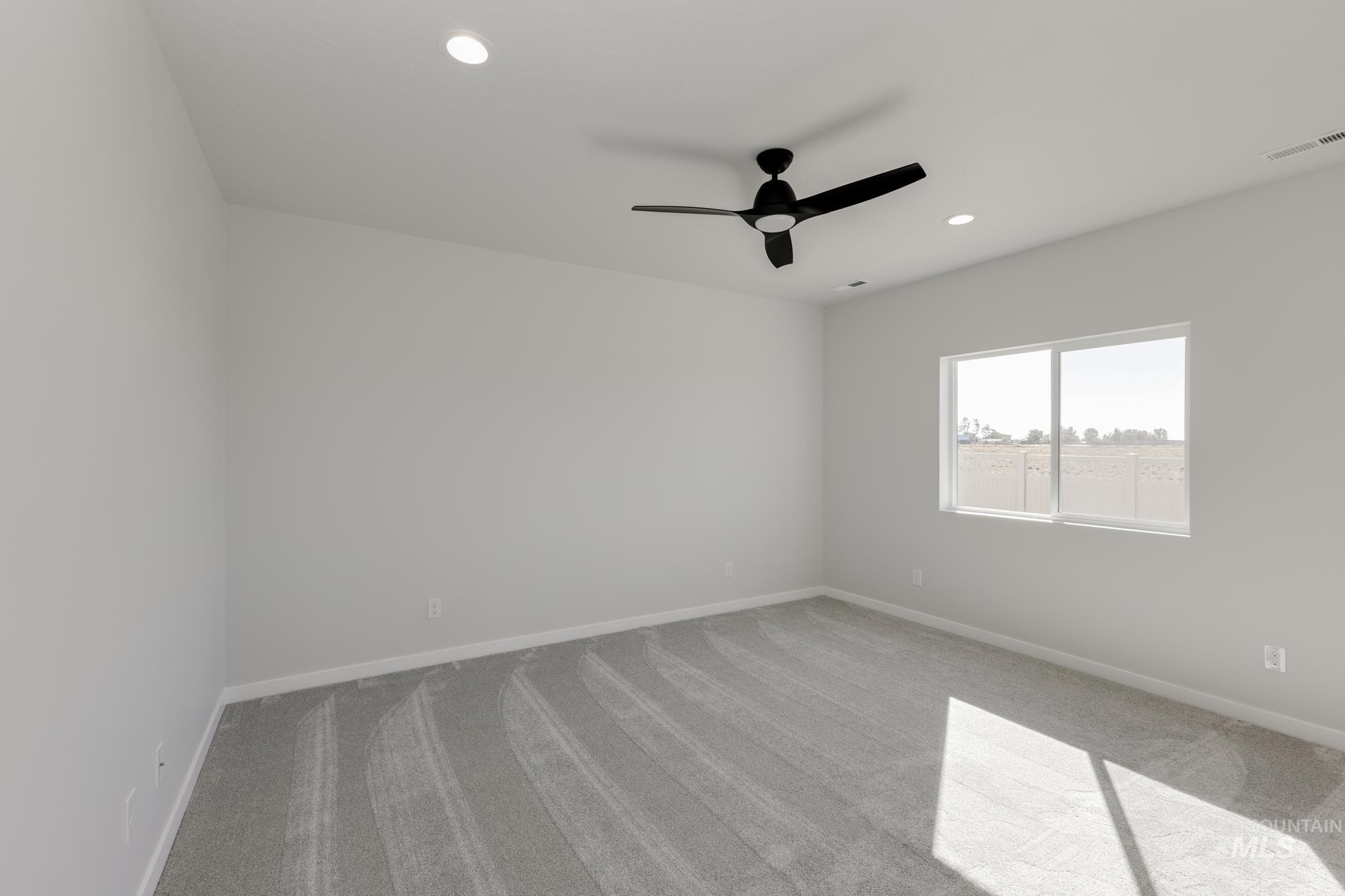 Unfurnished room with light colored carpet, recessed lighting, and ceiling fan