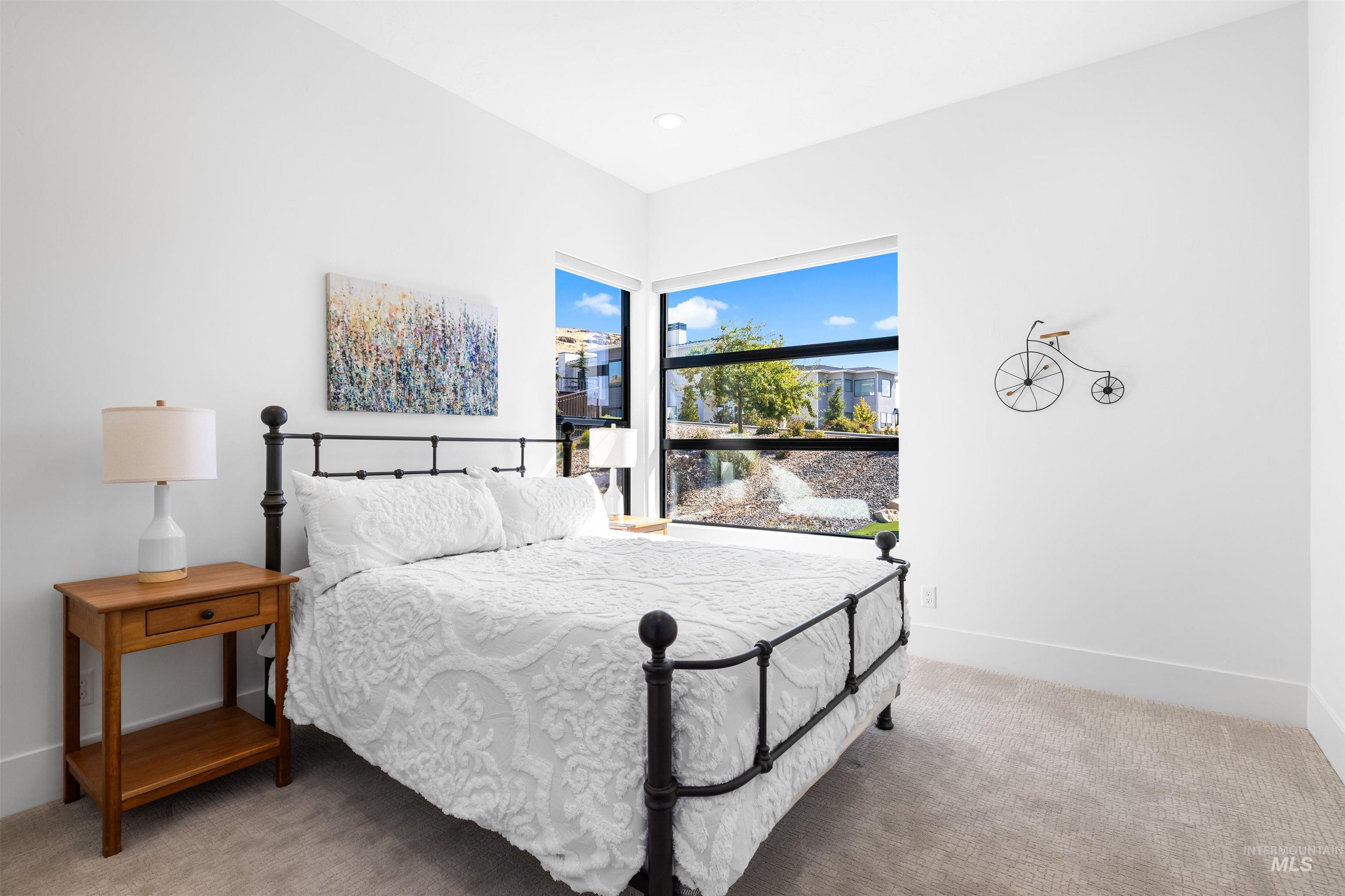 Bedroom featuring light colored carpet and recessed lighting