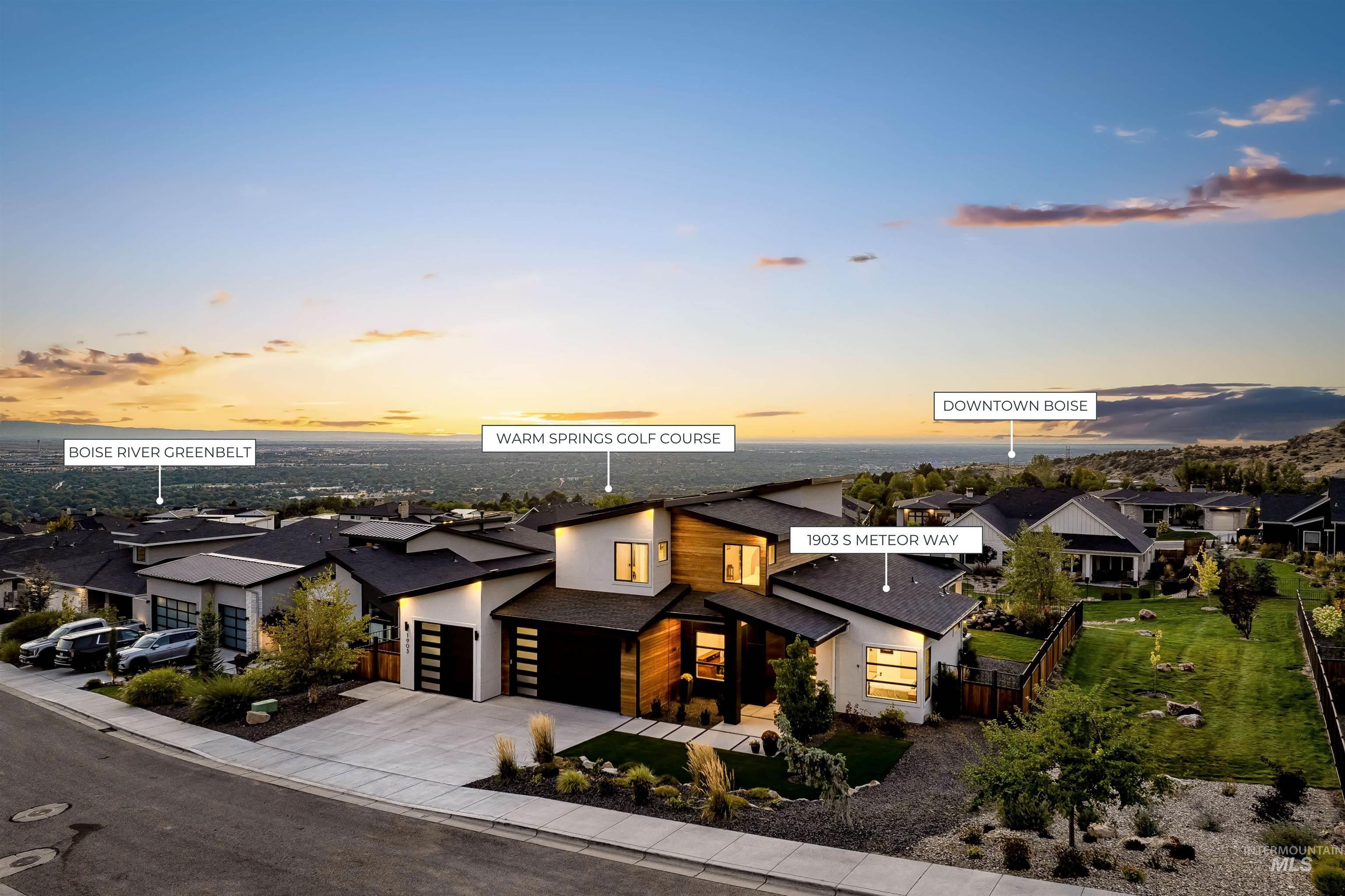 Contemporary house with a residential view, driveway, roof with shingles, and stucco siding