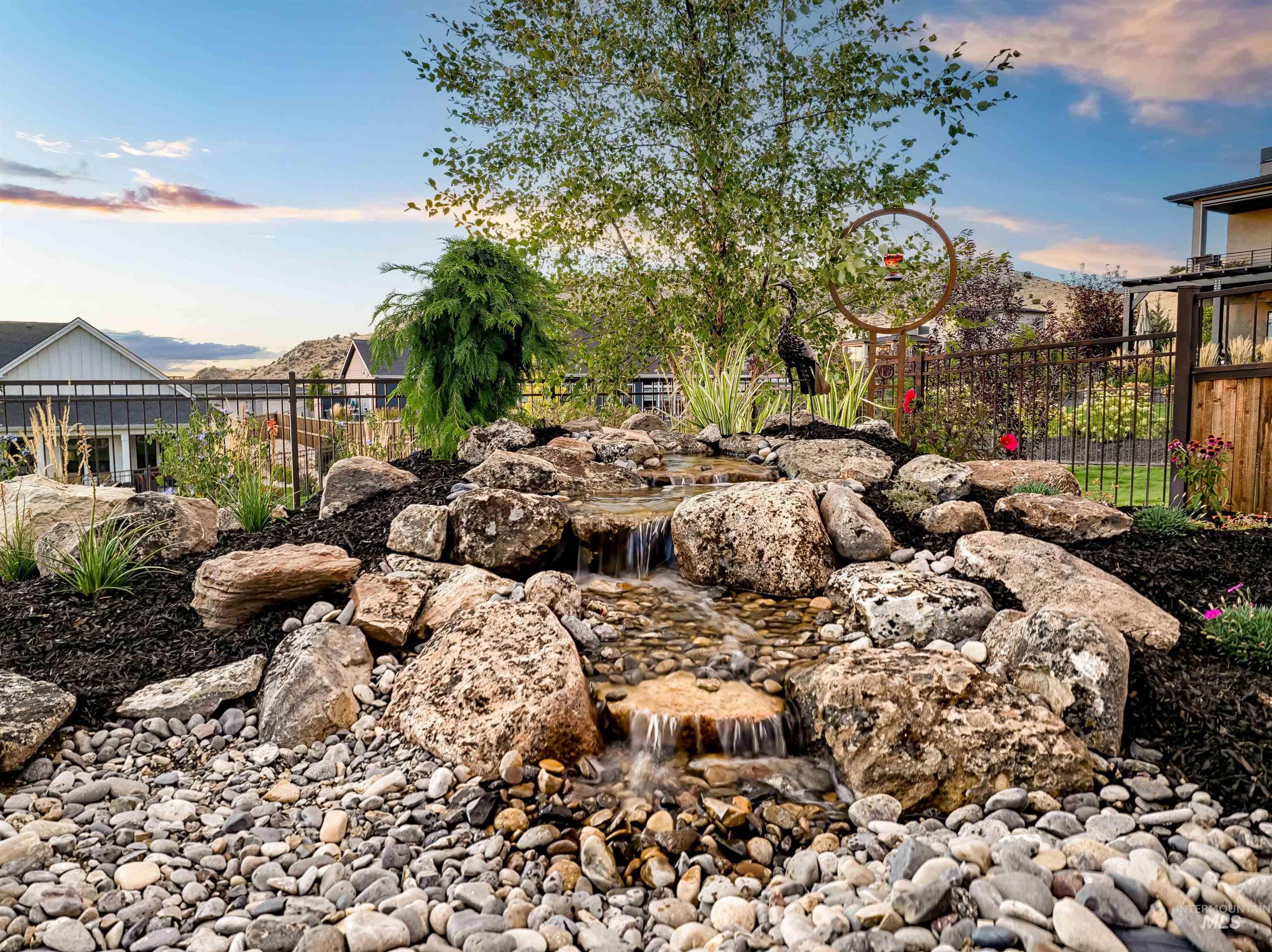View of yard with a garden pond